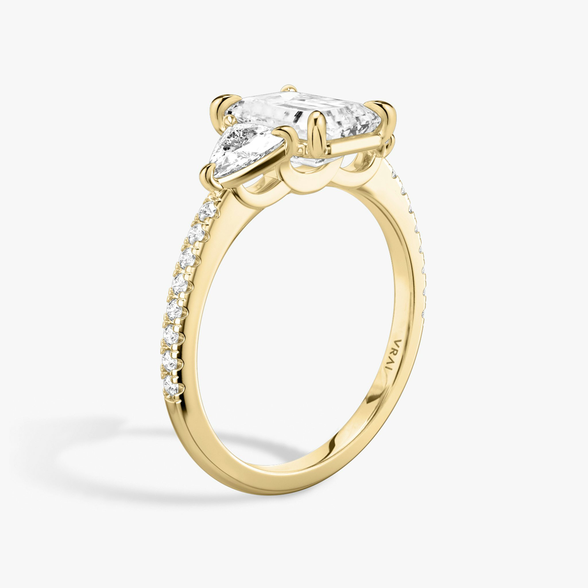 The Three Stone | Emerald | 18k | Yellow Gold | bandAccent: Pavé | sideStoneCarat: 0.25ct | sideStoneShape: Trillion | diamondOrientation: vertical | caratWeight: other