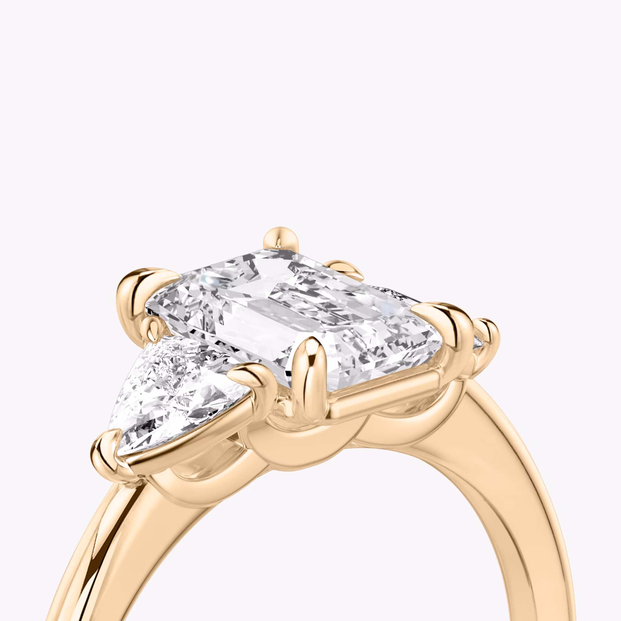 The Three Stone | Emerald | 14k | Rose Gold | bandAccent: Plain | sideStoneCarat: 0.25ct | sideStoneShape: Trillion | diamondOrientation: vertical | caratWeight: other