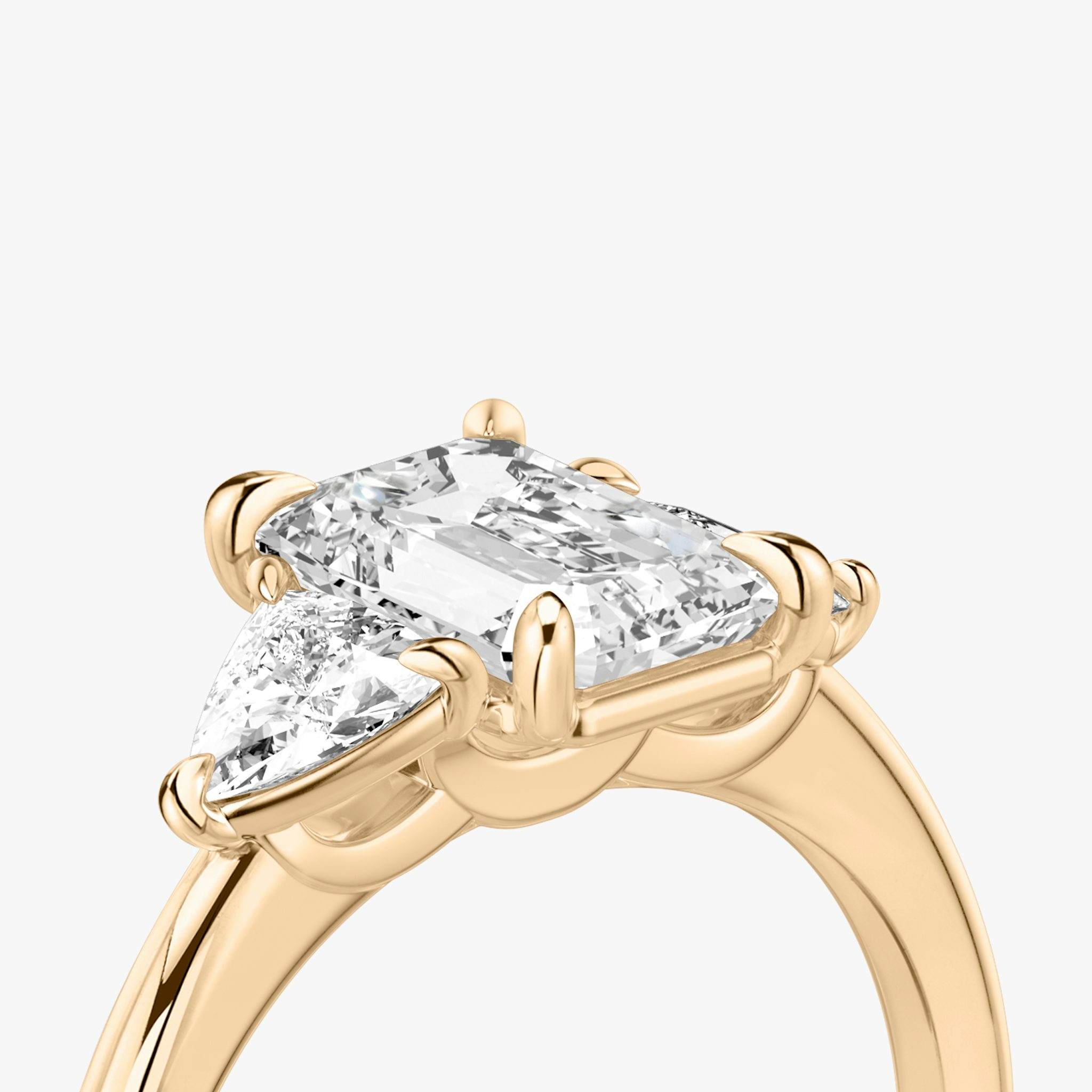 The Three Stone | Emerald | 14k | Rose Gold | bandAccent: Plain | sideStoneCarat: 0.25ct | sideStoneShape: Trillion | diamondOrientation: vertical | caratWeight: other