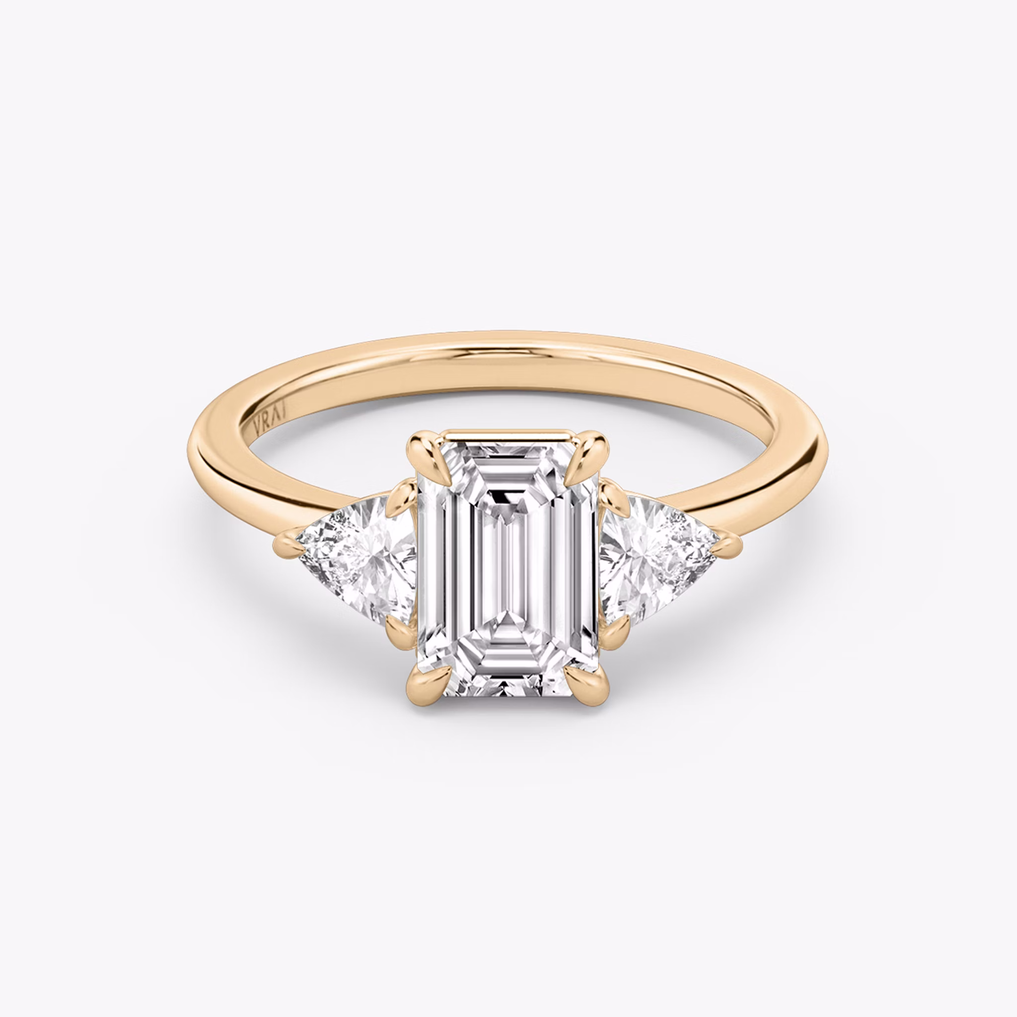 The Three Stone | Emerald | 14k | Rose Gold | bandAccent: Plain | sideStoneCarat: 0.25ct | sideStoneShape: Trillion | diamondOrientation: vertical | caratWeight: other