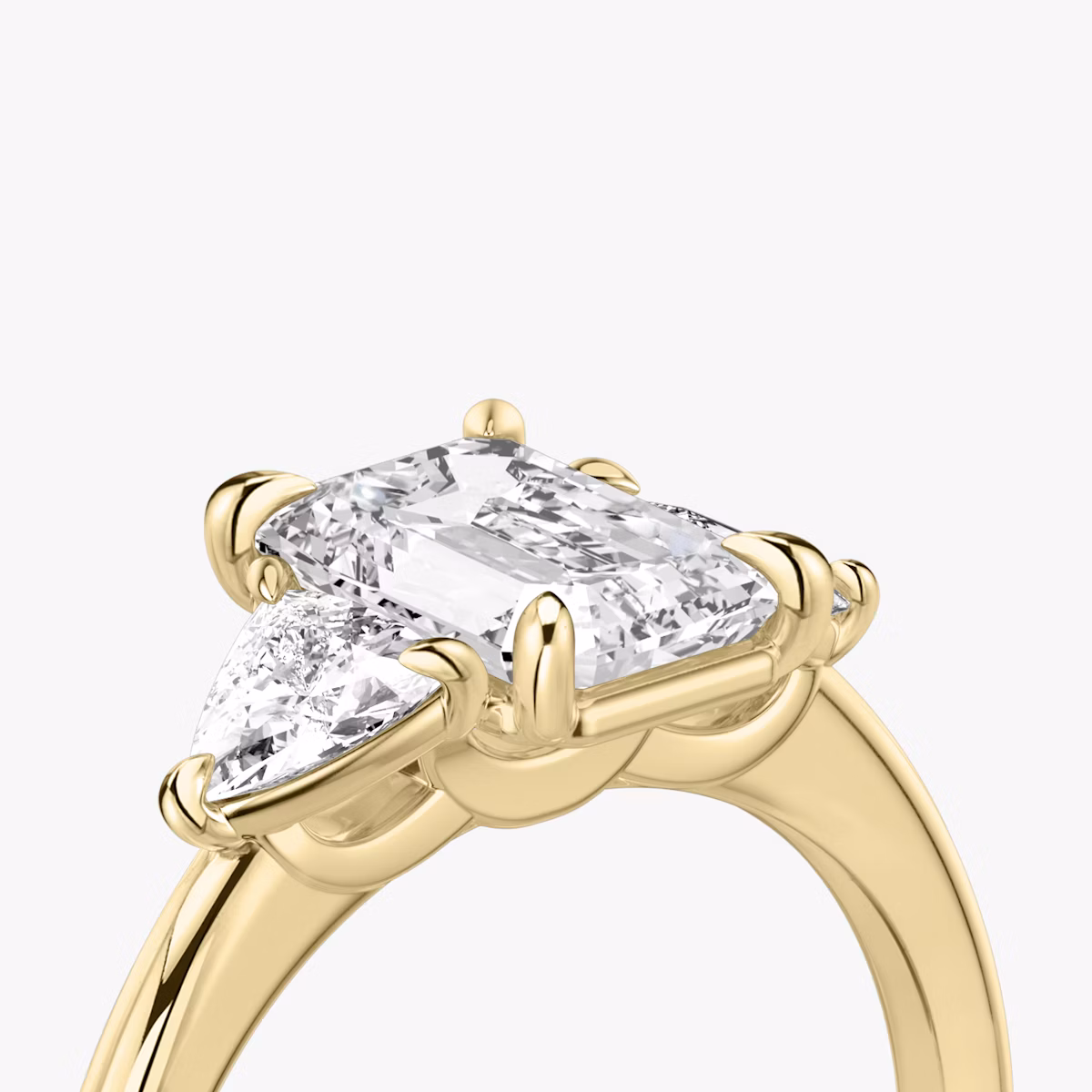 The Three Stone | Emerald | 18k | Yellow Gold | bandAccent: Plain | sideStoneCarat: 0.25ct | sideStoneShape: Trillion | diamondOrientation: vertical | caratWeight: other