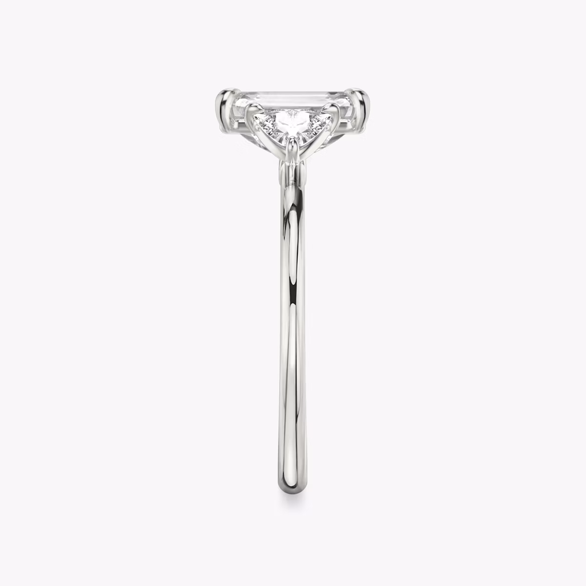 The Three Stone | Emerald | Platinum | bandAccent: Plain | sideStoneCarat: 0.25ct | sideStoneShape: Trillion | diamondOrientation: vertical | caratWeight: other