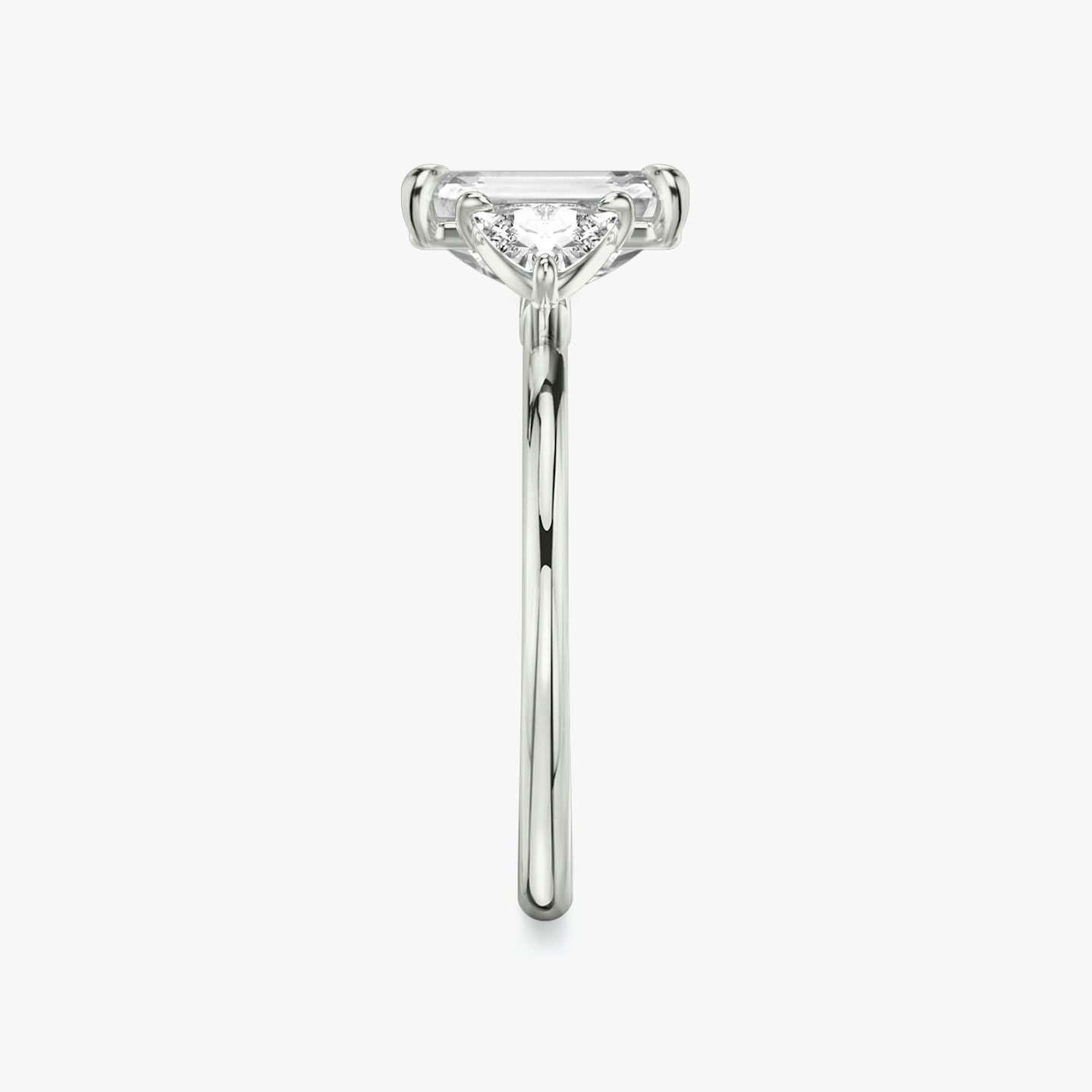 The Three Stone | Emerald | Platinum | bandAccent: Plain | sideStoneCarat: 0.25ct | sideStoneShape: Trillion | diamondOrientation: vertical | caratWeight: other