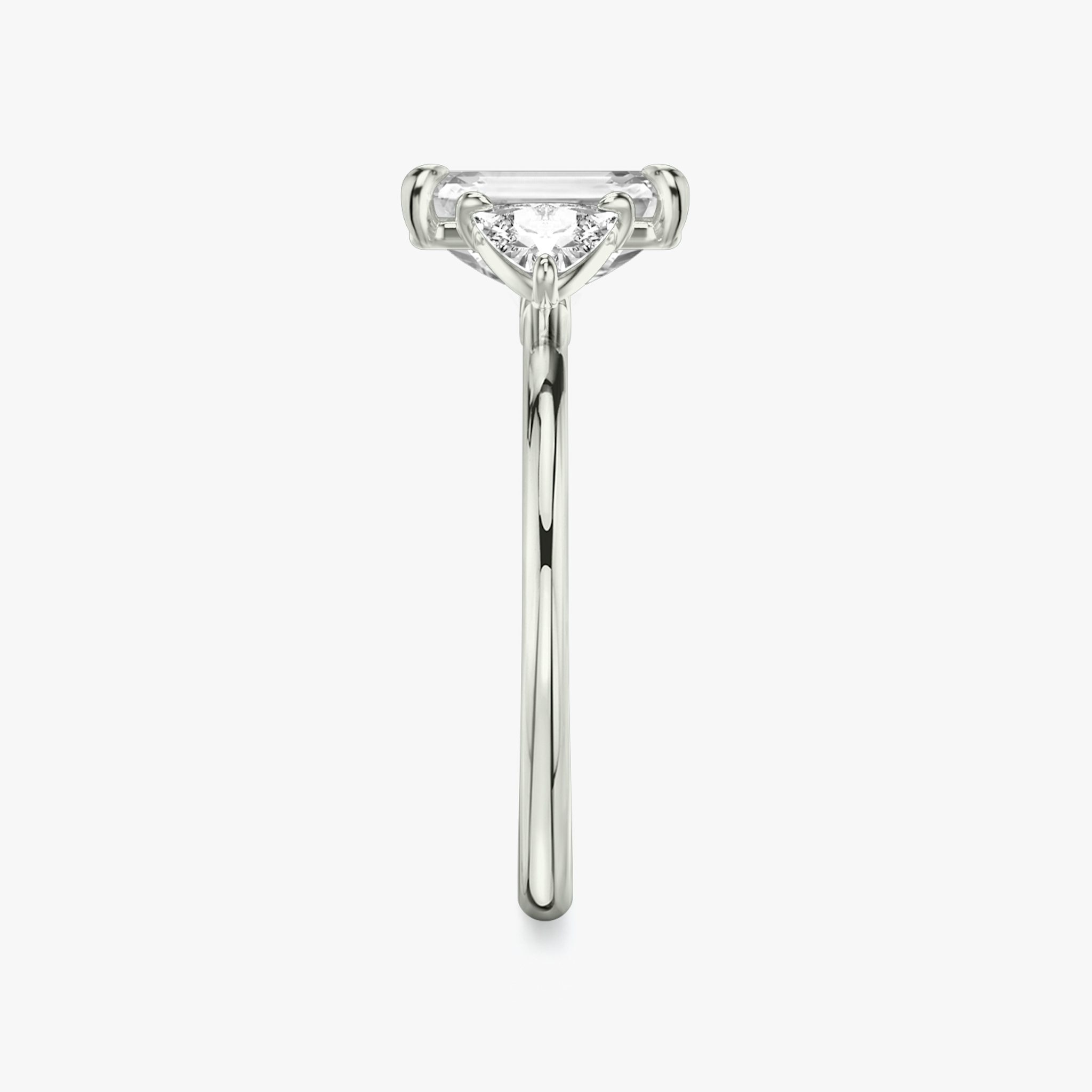 The Three Stone | Emerald | 18k | White Gold | bandAccent: Plain | sideStoneCarat: 0.25ct | sideStoneShape: Trillion | diamondOrientation: vertical | caratWeight: other