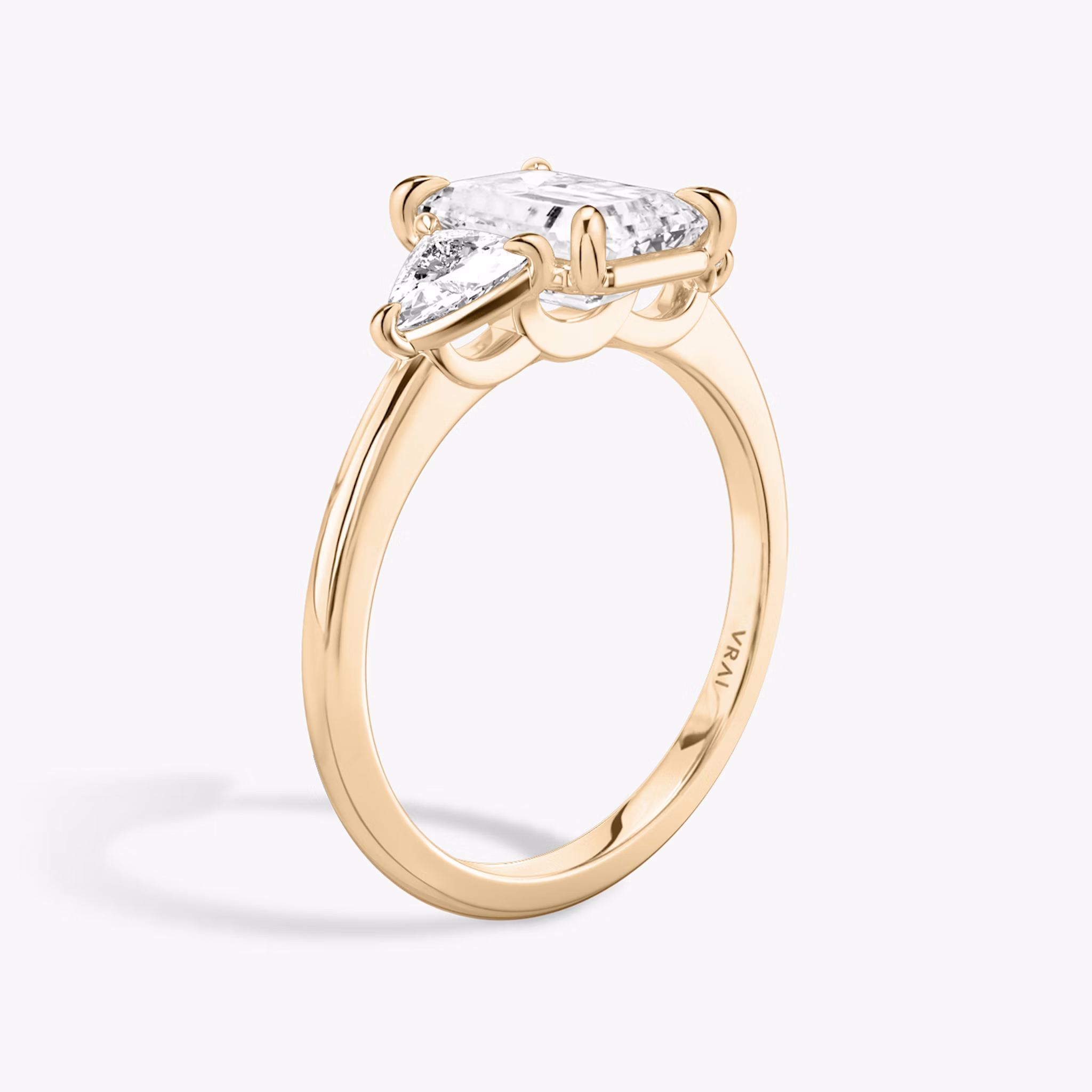 The Three Stone | Emerald | 14k | Rose Gold | bandAccent: Plain | sideStoneCarat: 0.25ct | sideStoneShape: Trillion | diamondOrientation: vertical | caratWeight: other
