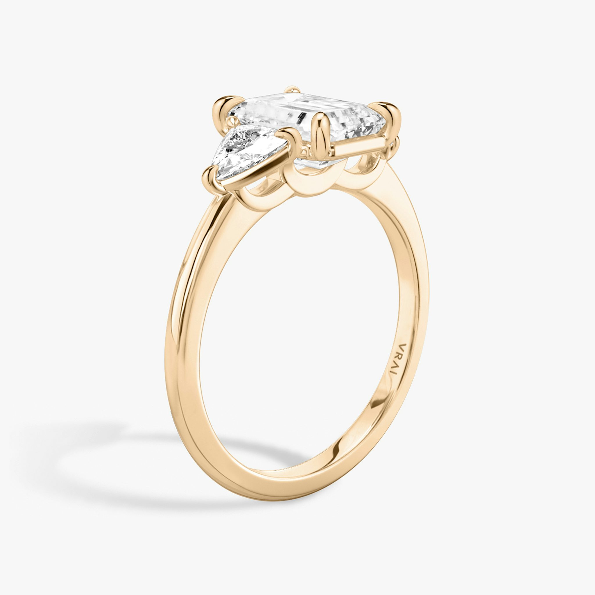 The Three Stone | Emerald | 14k | Rose Gold | bandAccent: Plain | sideStoneCarat: 0.25ct | sideStoneShape: Trillion | diamondOrientation: vertical | caratWeight: other