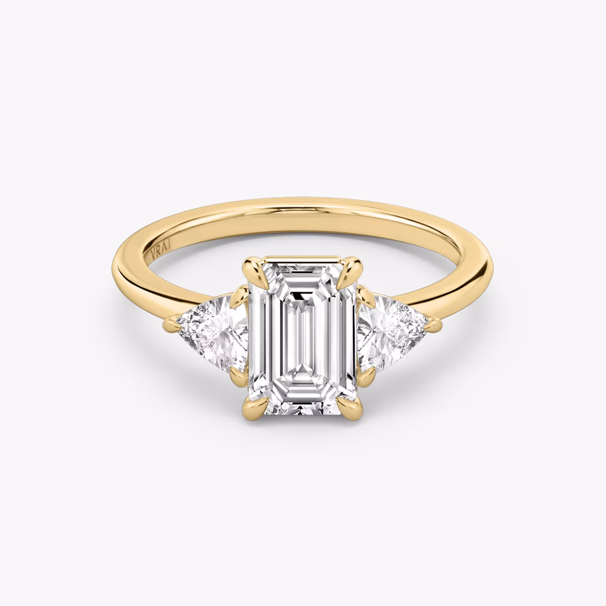 The Three Stone | Emerald | 18k | Yellow Gold | bandAccent: Plain | sideStoneCarat: 0.25ct | sideStoneShape: Trillion | diamondOrientation: vertical | caratWeight: other