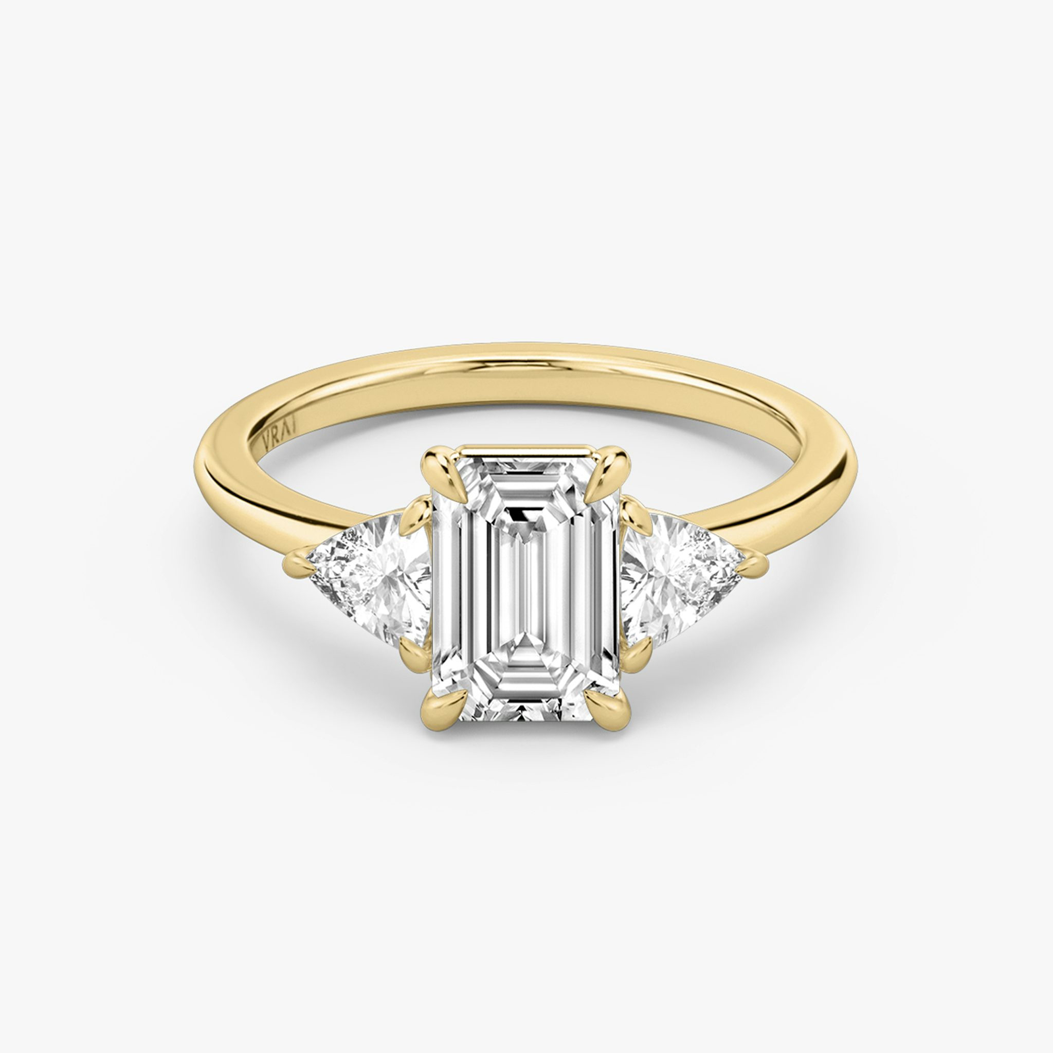 The Three Stone | Emerald | 18k | Yellow Gold | bandAccent: Plain | sideStoneCarat: 0.25ct | sideStoneShape: Trillion | diamondOrientation: vertical | caratWeight: other