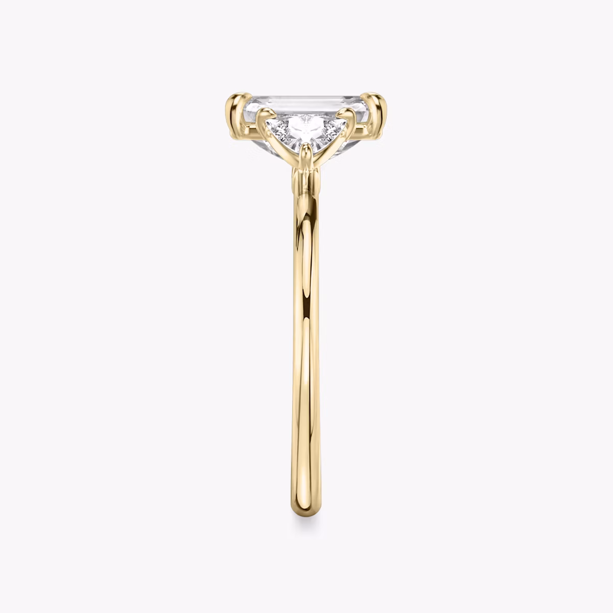 The Three Stone | Emerald | 18k | Yellow Gold | bandAccent: Plain | sideStoneCarat: 0.25ct | sideStoneShape: Trillion | diamondOrientation: vertical | caratWeight: other
