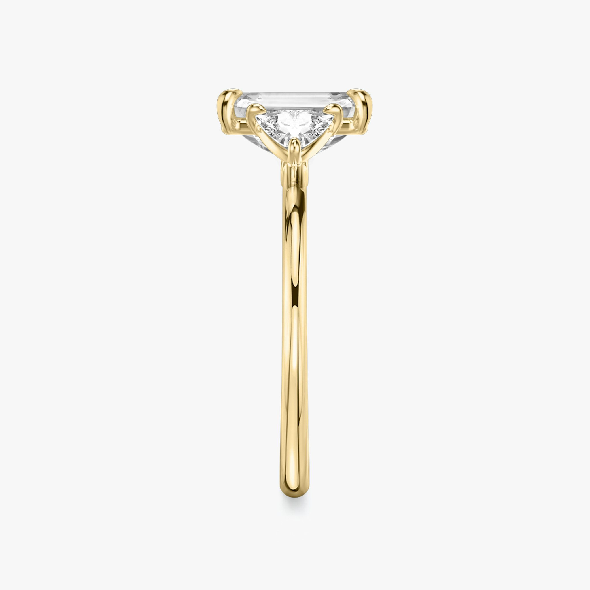 The Three Stone | Emerald | 18k | Yellow Gold | bandAccent: Plain | sideStoneCarat: 0.25ct | sideStoneShape: Trillion | diamondOrientation: vertical | caratWeight: other