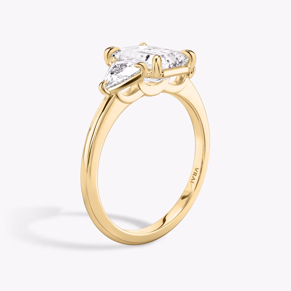 The Three Stone | Emerald | 18k | Yellow Gold | bandAccent: Plain | sideStoneCarat: 0.25ct | sideStoneShape: Trillion | diamondOrientation: vertical | caratWeight: other