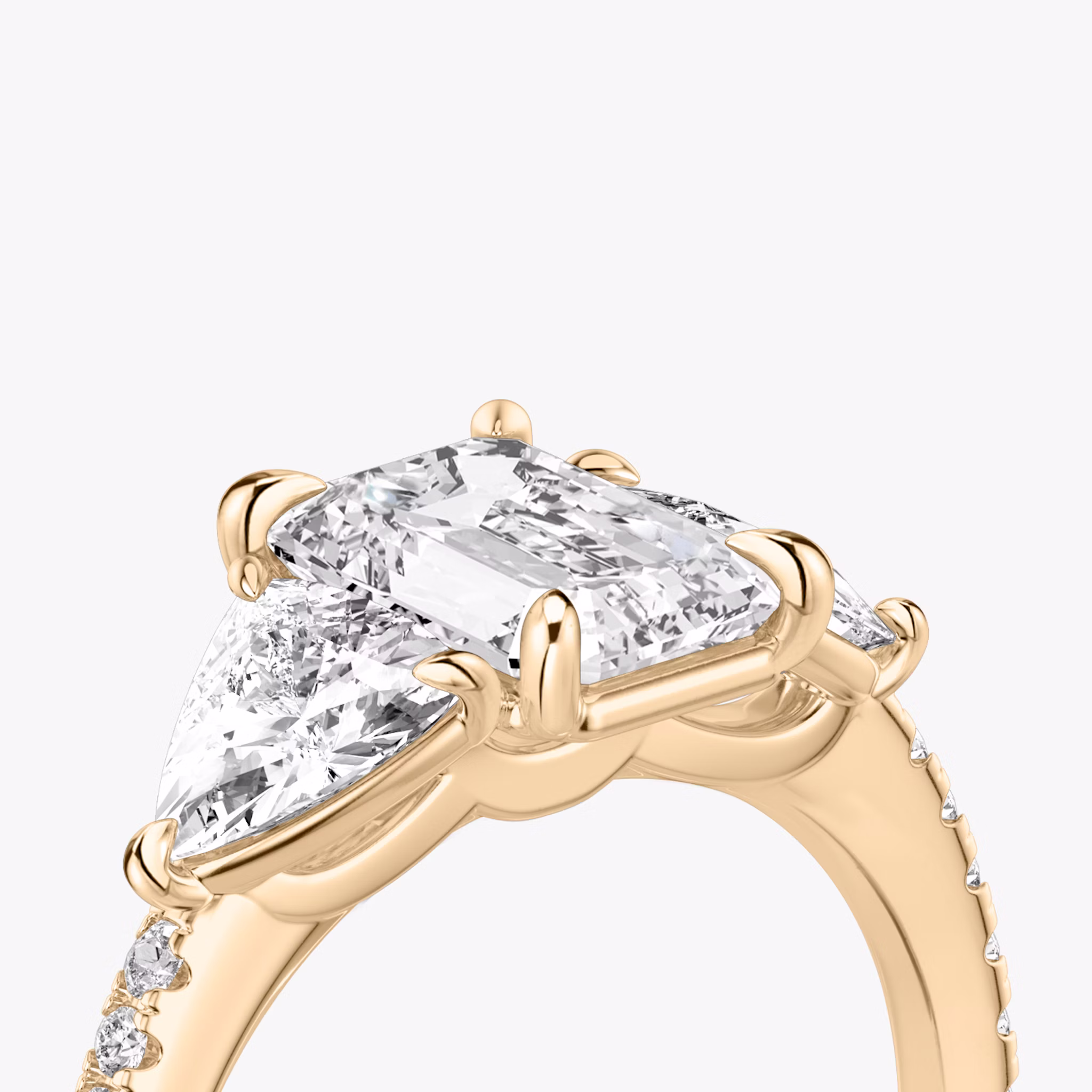 The Three Stone | Emerald | 14k | Rose Gold | bandAccent: Pavé | sideStoneCarat: 0.50ct | sideStoneShape: Trillion | diamondOrientation: vertical | caratWeight: other