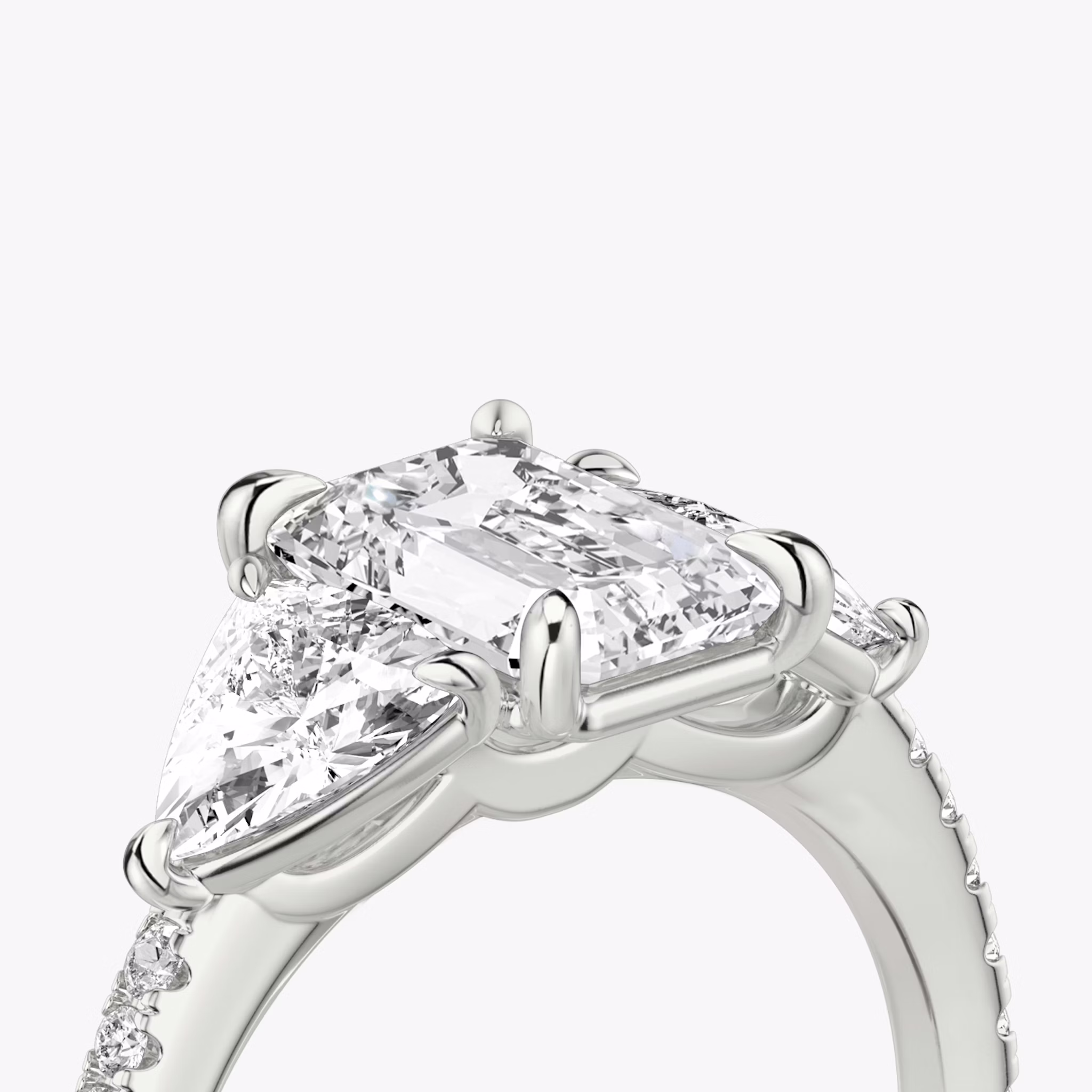 The Three Stone | Emerald | 18k | White Gold | bandAccent: Pavé | sideStoneCarat: 0.50ct | sideStoneShape: Trillion | diamondOrientation: vertical | caratWeight: other