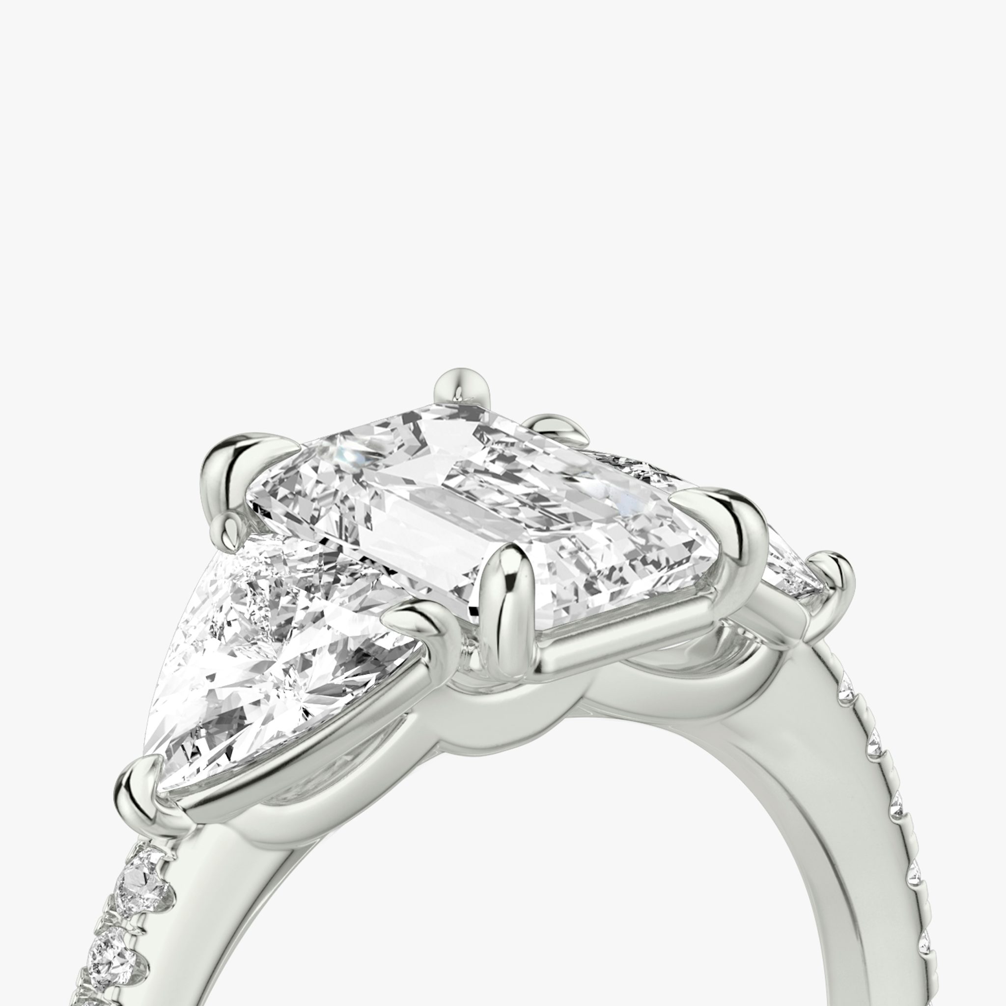 The Three Stone | Emerald | 18k | White Gold | bandAccent: Pavé | sideStoneCarat: 0.50ct | sideStoneShape: Trillion | diamondOrientation: vertical | caratWeight: other