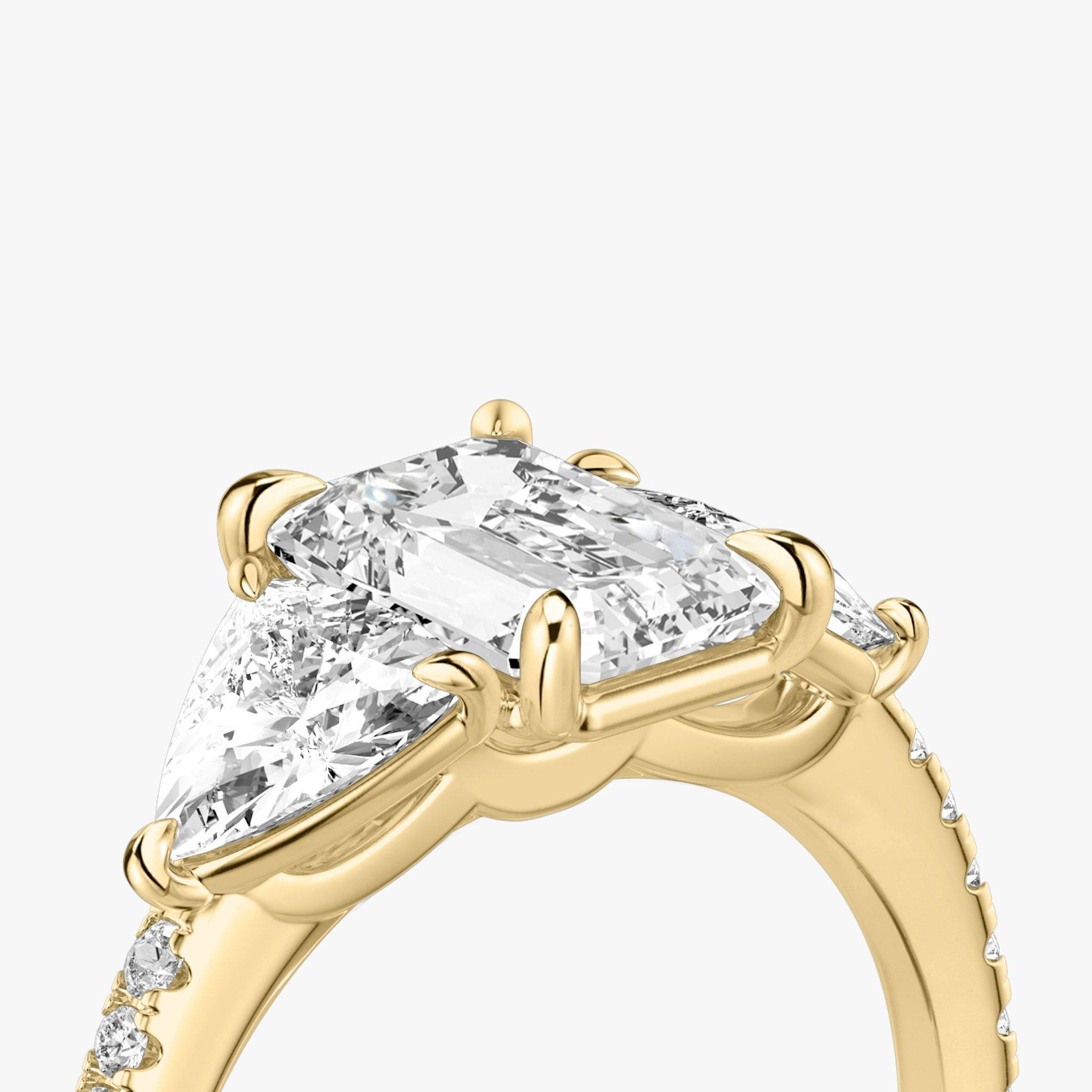 The Three Stone | Emerald | 18k | Yellow Gold | bandAccent: Pavé | sideStoneCarat: 0.50ct | sideStoneShape: Trillion | diamondOrientation: vertical | caratWeight: other