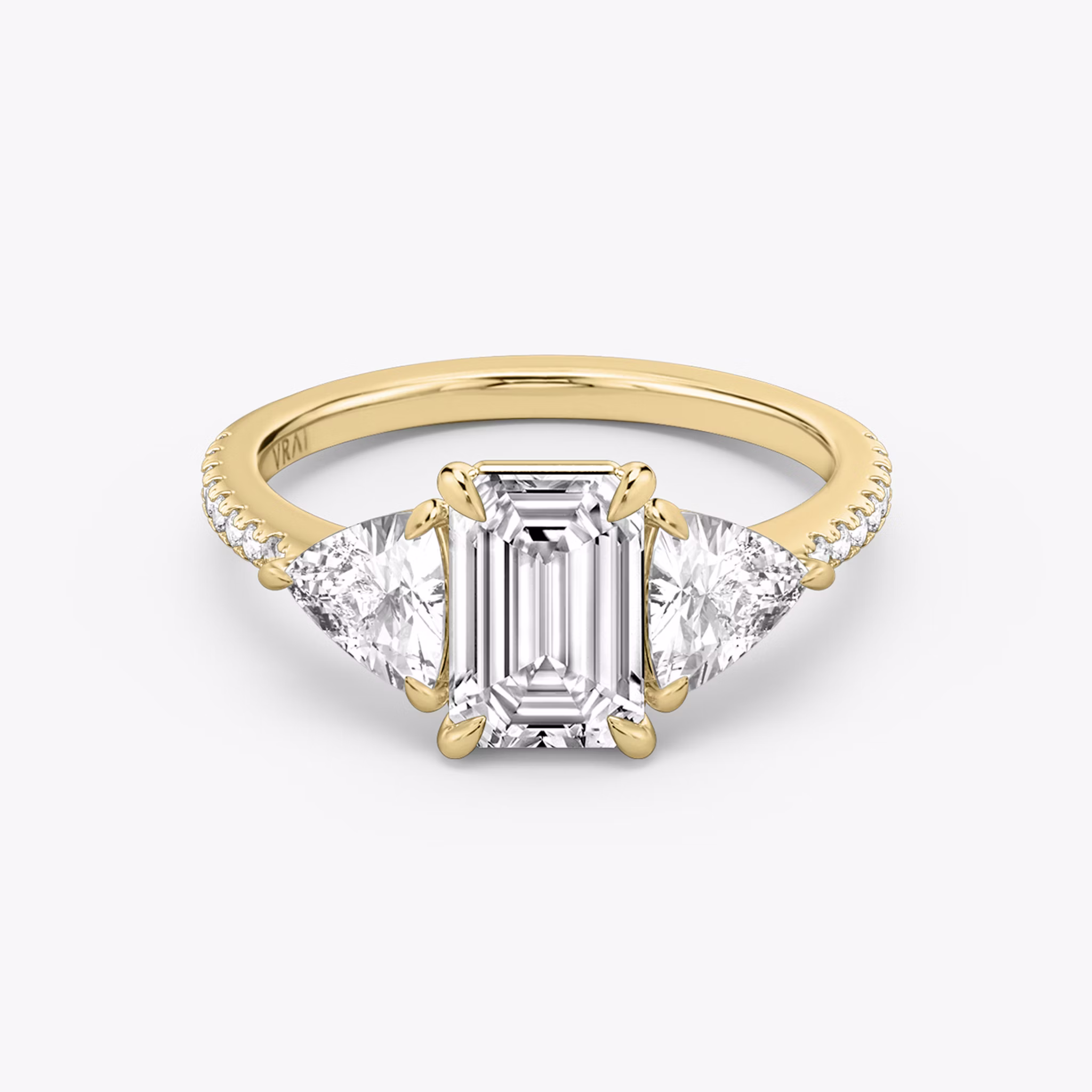 The Three Stone | Emerald | 18k | Yellow Gold | bandAccent: Pavé | sideStoneCarat: 0.50ct | sideStoneShape: Trillion | diamondOrientation: vertical | caratWeight: other