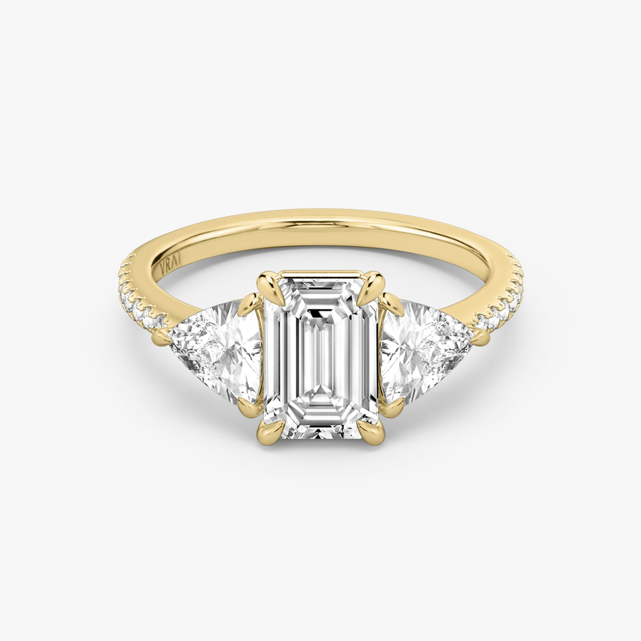 The Three Stone | Emerald | 18k | Yellow Gold | bandAccent: Pavé | sideStoneCarat: 0.50ct | sideStoneShape: Trillion | diamondOrientation: vertical | caratWeight: other