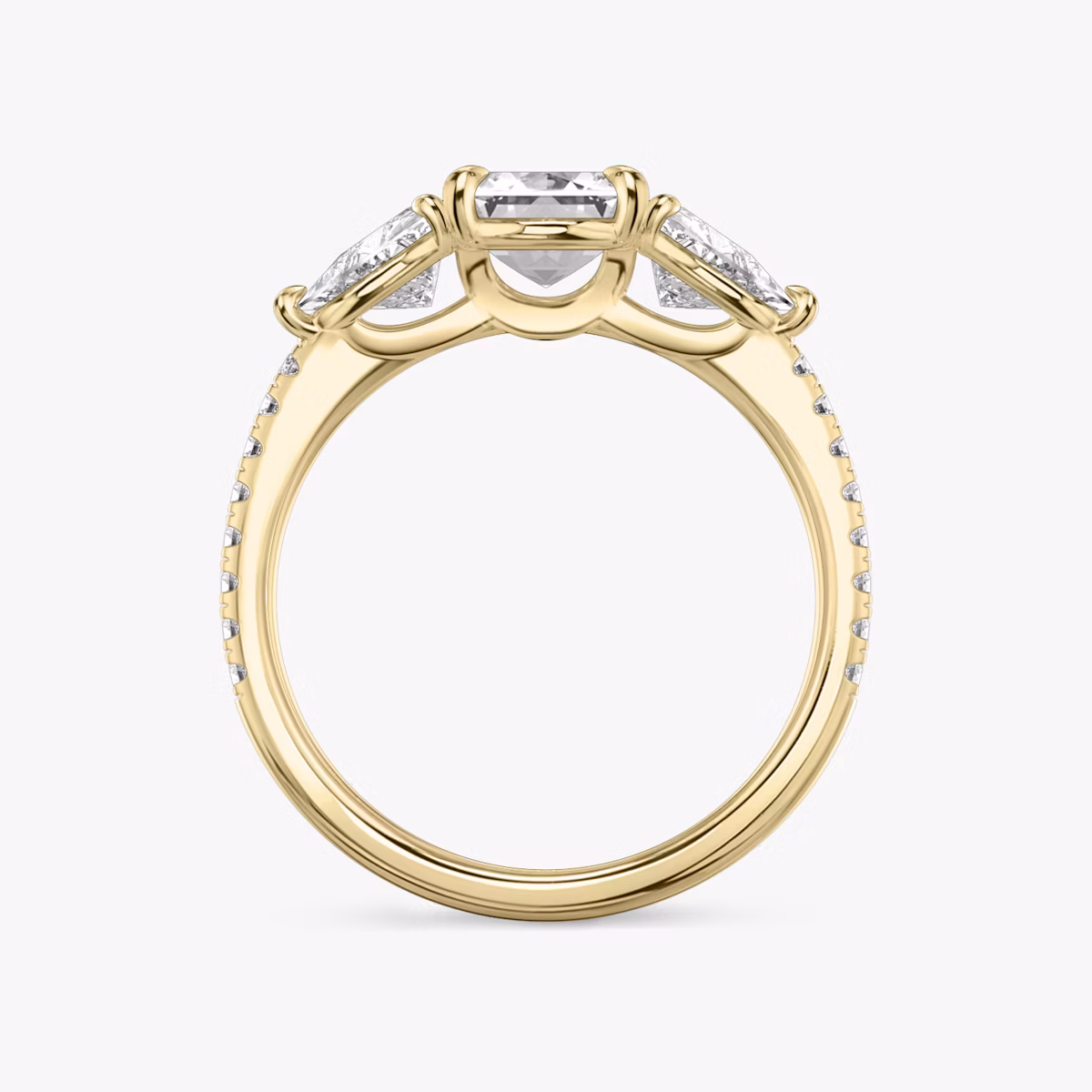 The Three Stone | Emerald | 18k | Yellow Gold | bandAccent: Pavé | sideStoneCarat: 0.50ct | sideStoneShape: Trillion | diamondOrientation: vertical | caratWeight: other