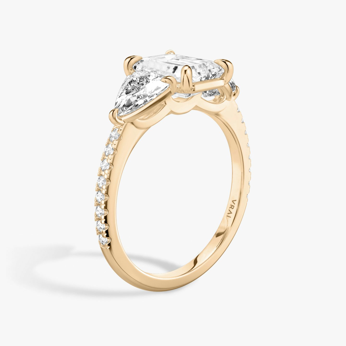 The Three Stone | Emerald | 14k | Rose Gold | bandAccent: Pavé | sideStoneCarat: 0.50ct | sideStoneShape: Trillion | diamondOrientation: vertical | caratWeight: other