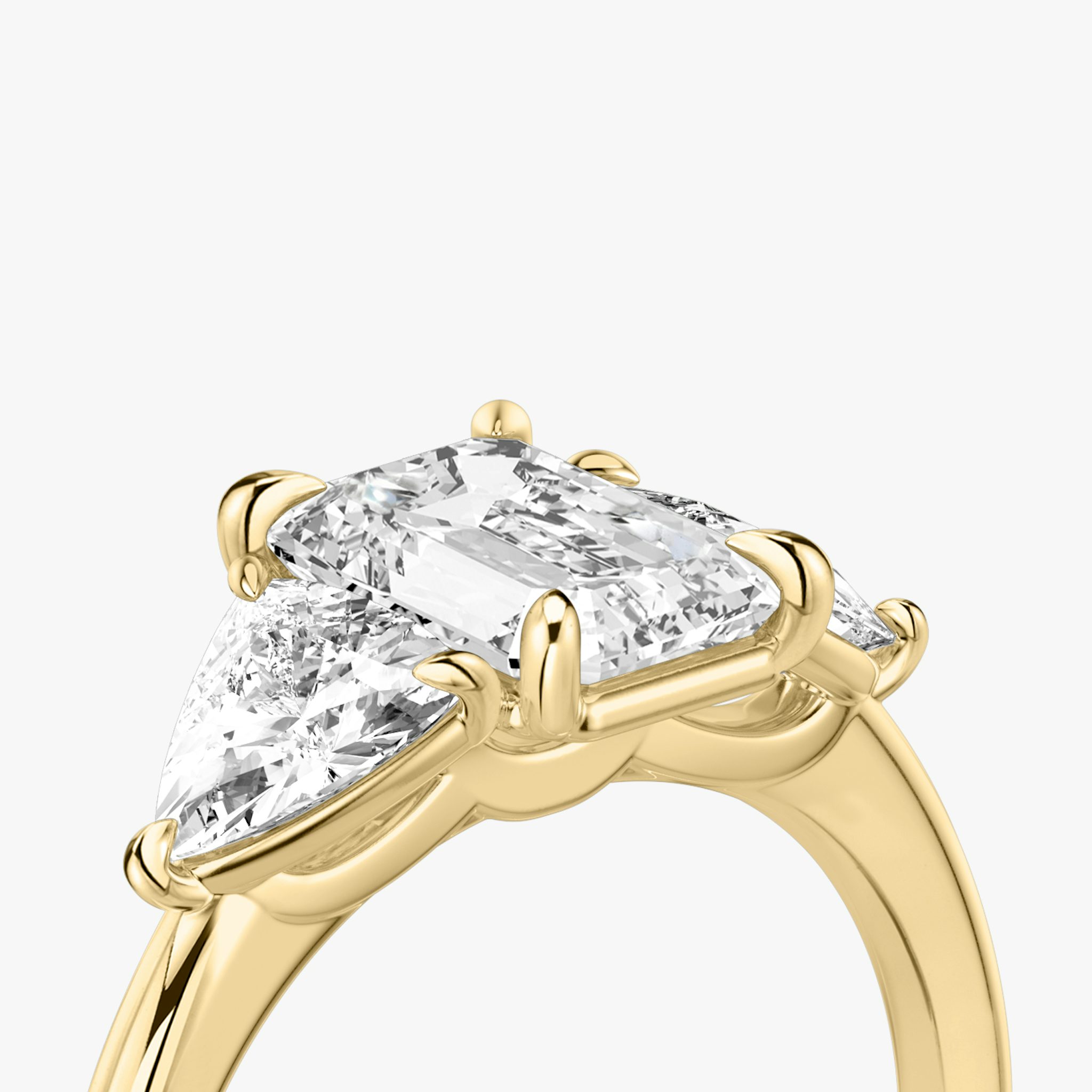 The Three Stone | Emerald | 18k | Yellow Gold | bandAccent: Plain | sideStoneCarat: 0.50ct | sideStoneShape: Trillion | diamondOrientation: vertical | caratWeight: other