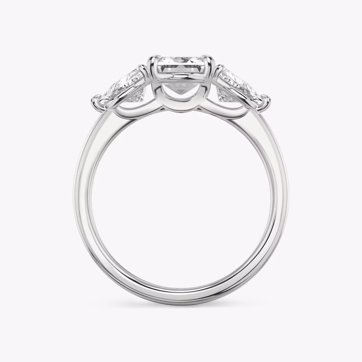 The Three Stone | Emerald | Platinum | bandAccent: Plain | sideStoneCarat: 0.50ct | sideStoneShape: Trillion | diamondOrientation: vertical | caratWeight: other