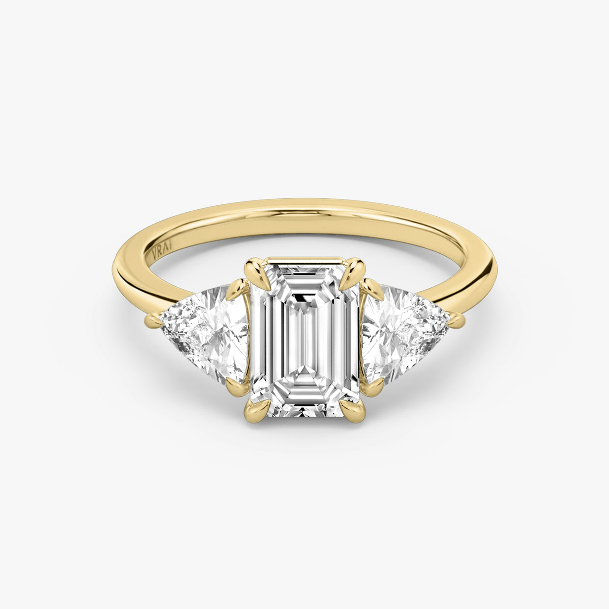 The Three Stone | Emerald | 18k | Yellow Gold | bandAccent: Plain | sideStoneCarat: 0.50ct | sideStoneShape: Trillion | diamondOrientation: vertical | caratWeight: other