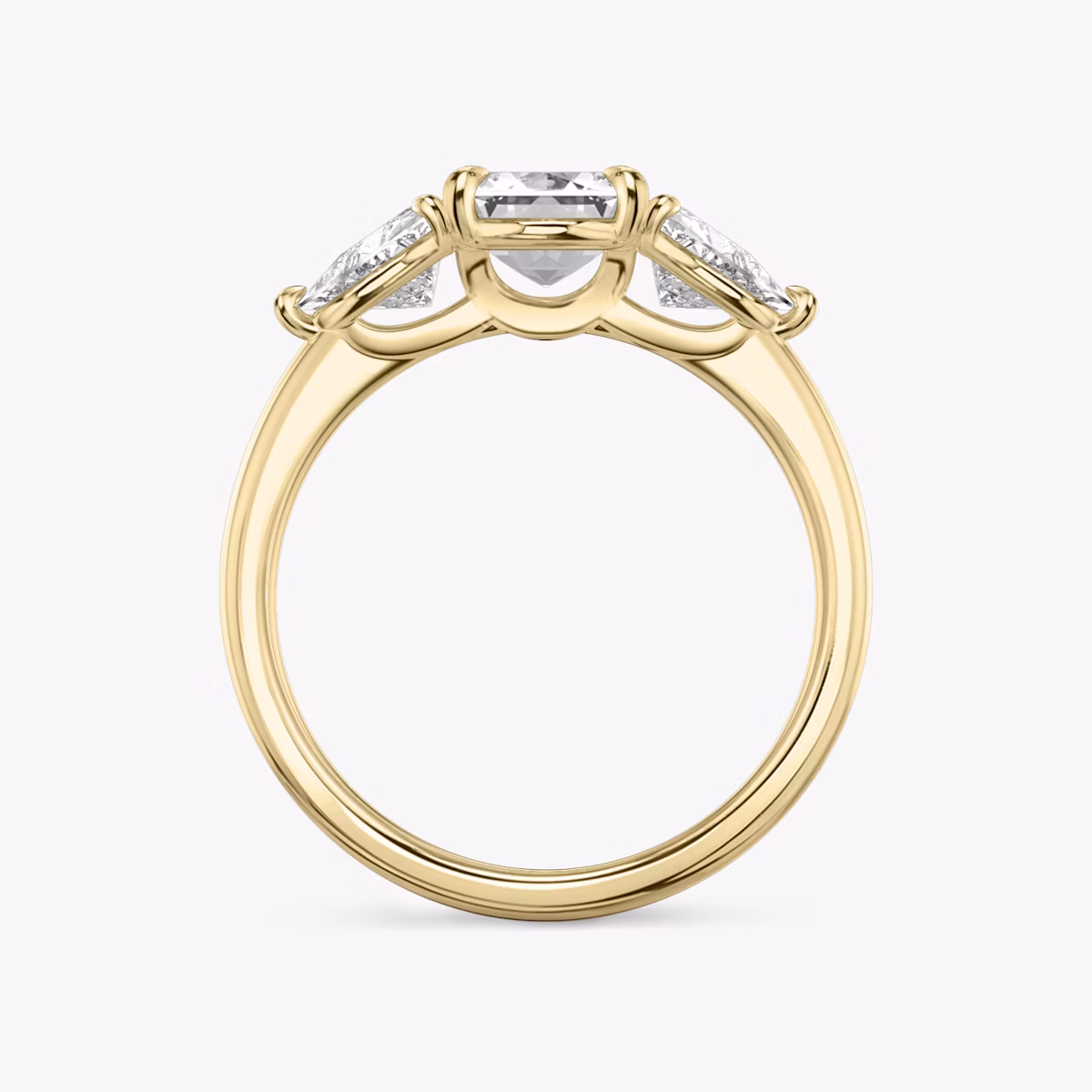 The Three Stone | Emerald | 18k | Yellow Gold | bandAccent: Plain | sideStoneCarat: 0.50ct | sideStoneShape: Trillion | diamondOrientation: vertical | caratWeight: other