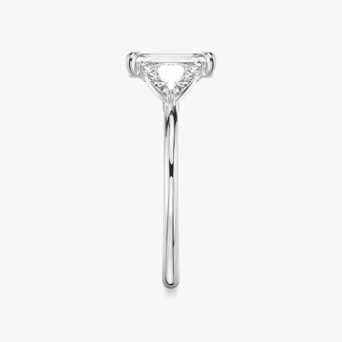 The Three Stone | Emerald | Platinum | bandAccent: Plain | sideStoneCarat: 0.50ct | sideStoneShape: Trillion | diamondOrientation: vertical | caratWeight: other
