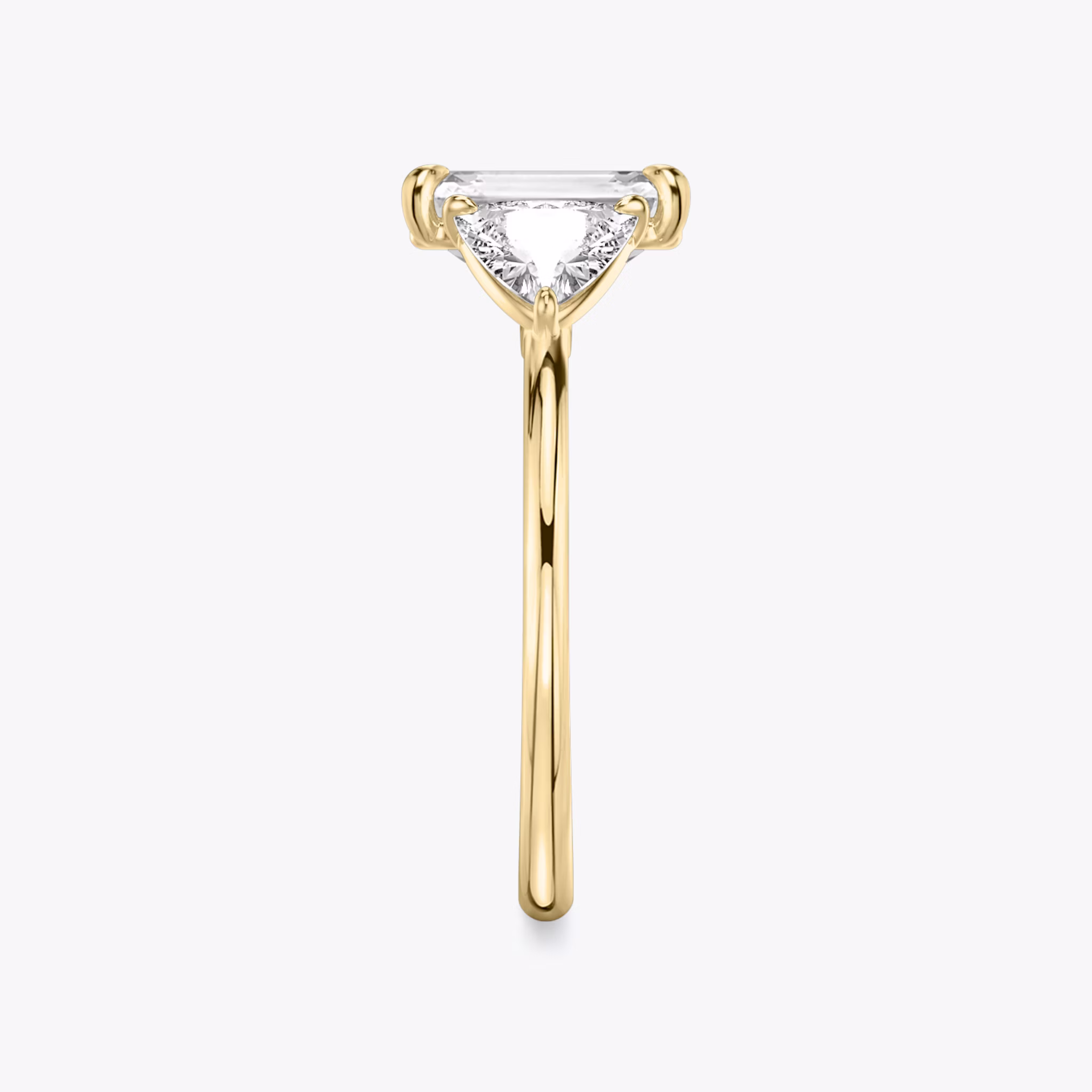 The Three Stone | Emerald | 18k | Yellow Gold | bandAccent: Plain | sideStoneCarat: 0.50ct | sideStoneShape: Trillion | diamondOrientation: vertical | caratWeight: other