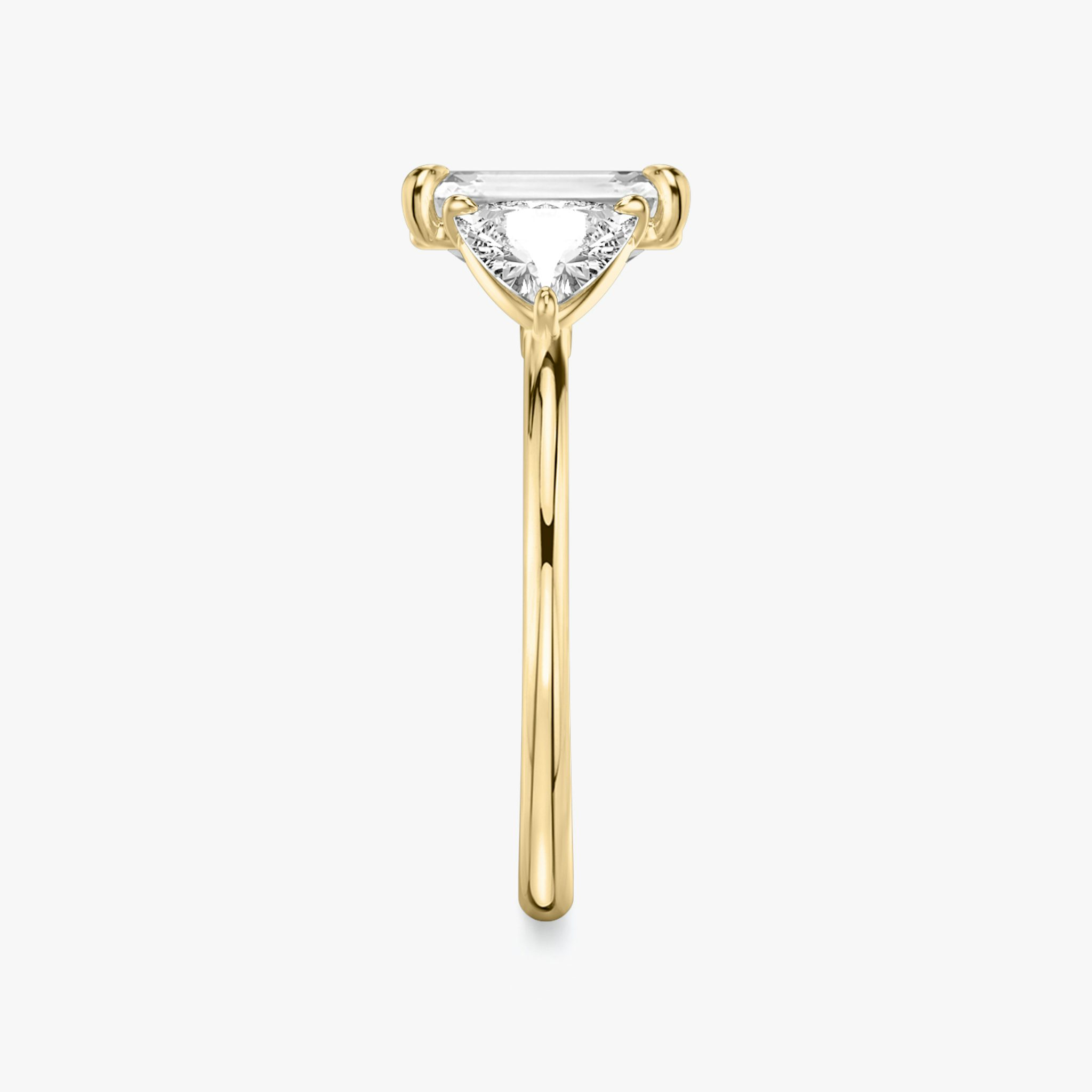 The Three Stone | Emerald | 18k | Yellow Gold | bandAccent: Plain | sideStoneCarat: 0.50ct | sideStoneShape: Trillion | diamondOrientation: vertical | caratWeight: other