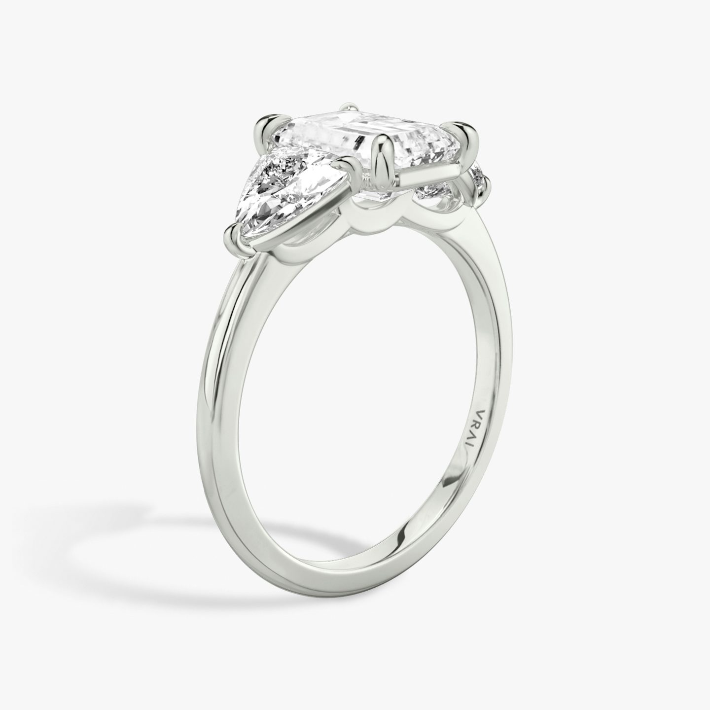 The Three Stone | Emerald | 18k | White Gold | bandAccent: Plain | sideStoneCarat: 0.50ct | sideStoneShape: Trillion | diamondOrientation: vertical | caratWeight: other