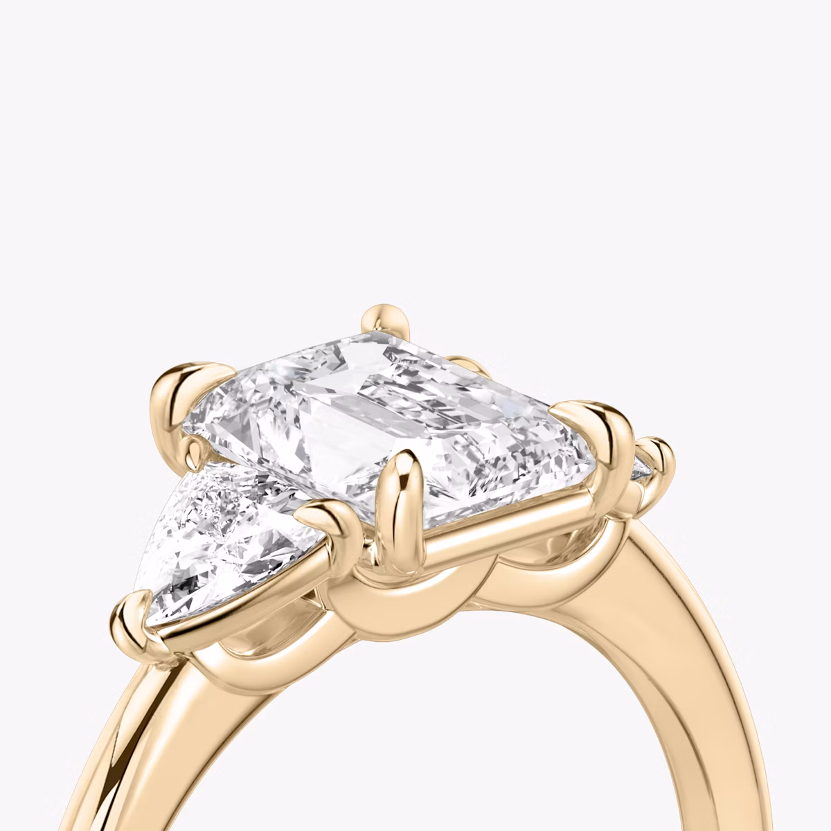 The Three Stone | Radiant | 14k | Rose Gold | bandAccent: Plain | sideStoneCarat: 0.25ct | sideStoneShape: Trillion | diamondOrientation: vertical | caratWeight: other
