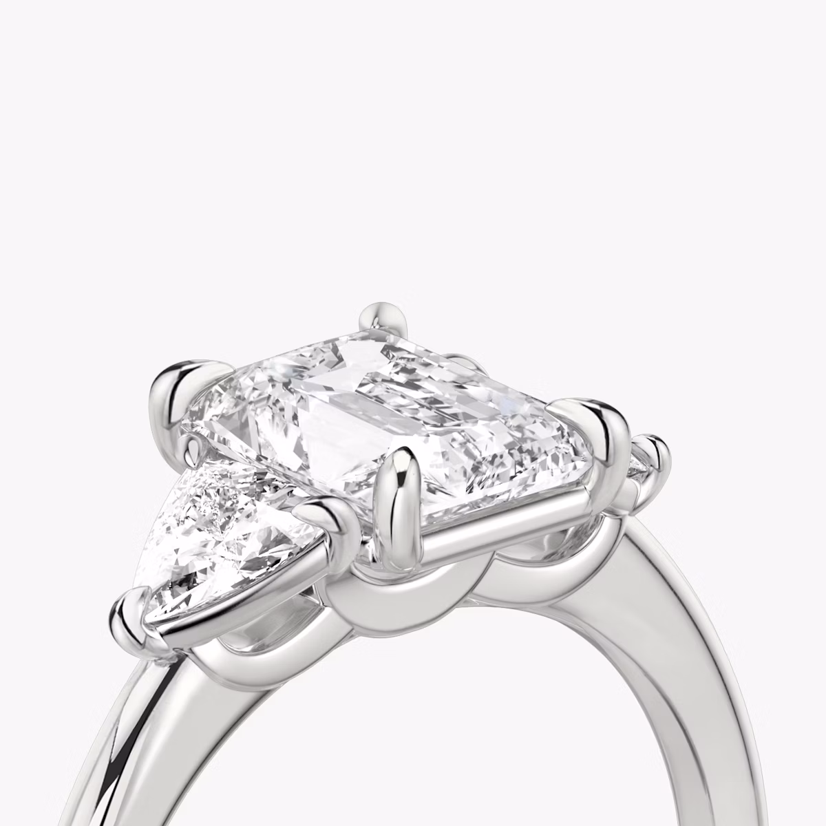The Three Stone | Radiant | 18k | White Gold | bandAccent: Plain | sideStoneCarat: 0.25ct | sideStoneShape: Trillion | diamondOrientation: vertical | caratWeight: other