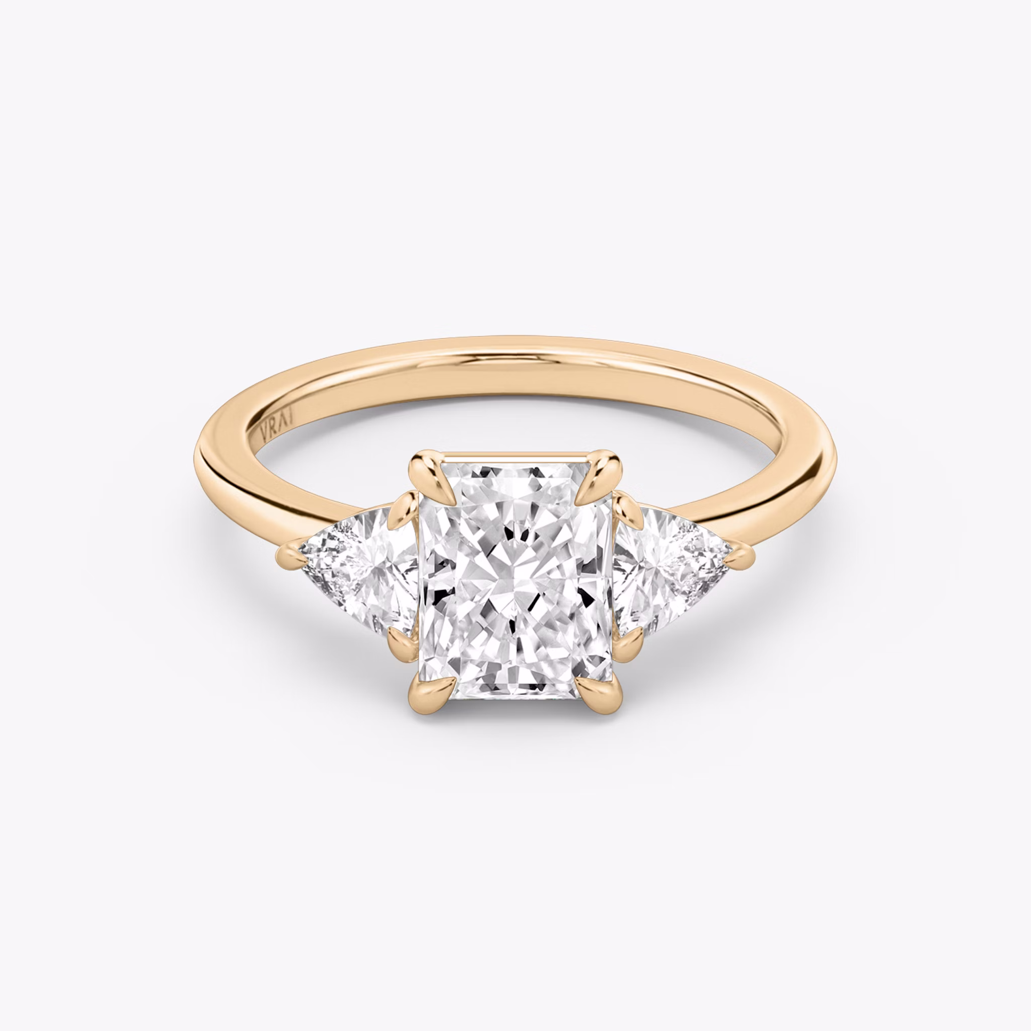 The Three Stone | Radiant | 14k | Rose Gold | bandAccent: Plain | sideStoneCarat: 0.25ct | sideStoneShape: Trillion | diamondOrientation: vertical | caratWeight: other