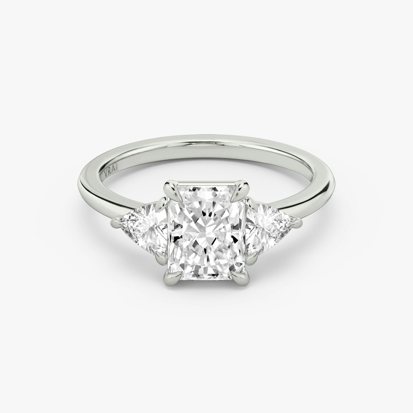The Three Stone | Radiant | Platinum | bandAccent: Plain | sideStoneCarat: 0.25ct | sideStoneShape: Trillion | diamondOrientation: vertical | caratWeight: other