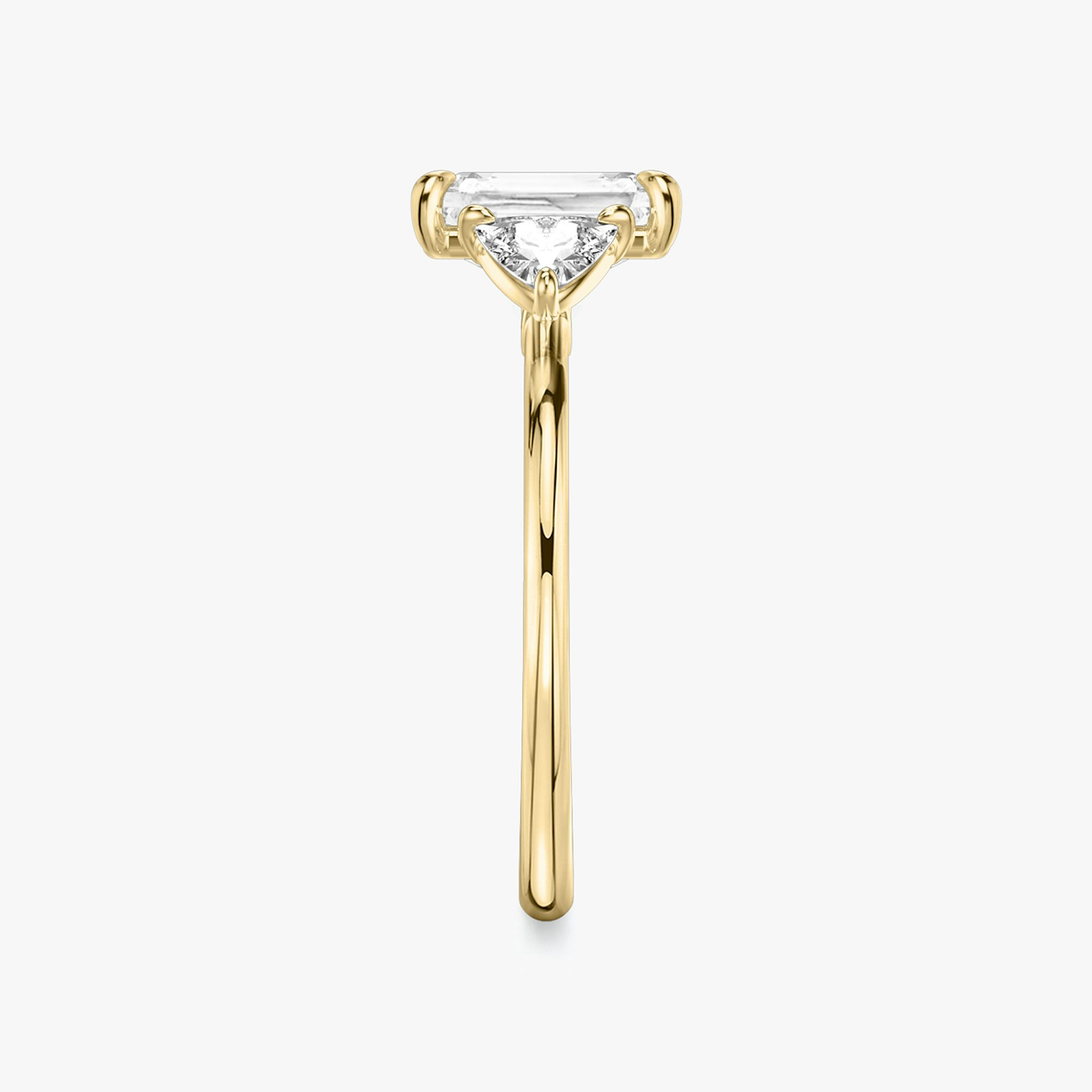 The Three Stone | Radiant | 18k | Yellow Gold | bandAccent: Plain | sideStoneCarat: 0.25ct | sideStoneShape: Trillion | diamondOrientation: vertical | caratWeight: other