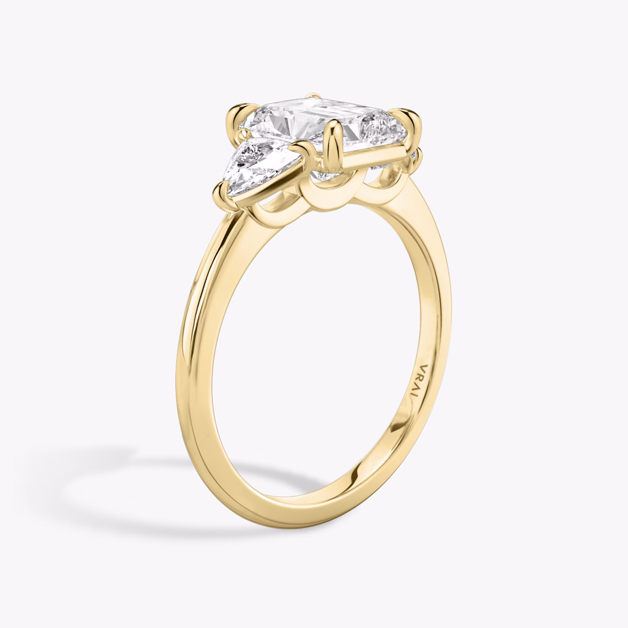 The Three Stone | Radiant | 18k | Yellow Gold | bandAccent: Plain | sideStoneCarat: 0.25ct | sideStoneShape: Trillion | diamondOrientation: vertical | caratWeight: other