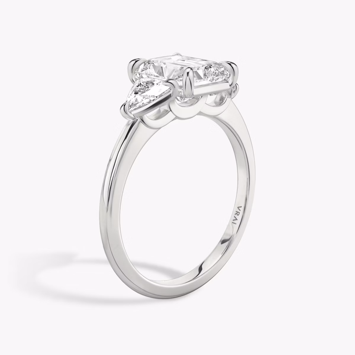 The Three Stone | Radiant | 18k | White Gold | bandAccent: Plain | sideStoneCarat: 0.25ct | sideStoneShape: Trillion | diamondOrientation: vertical | caratWeight: other