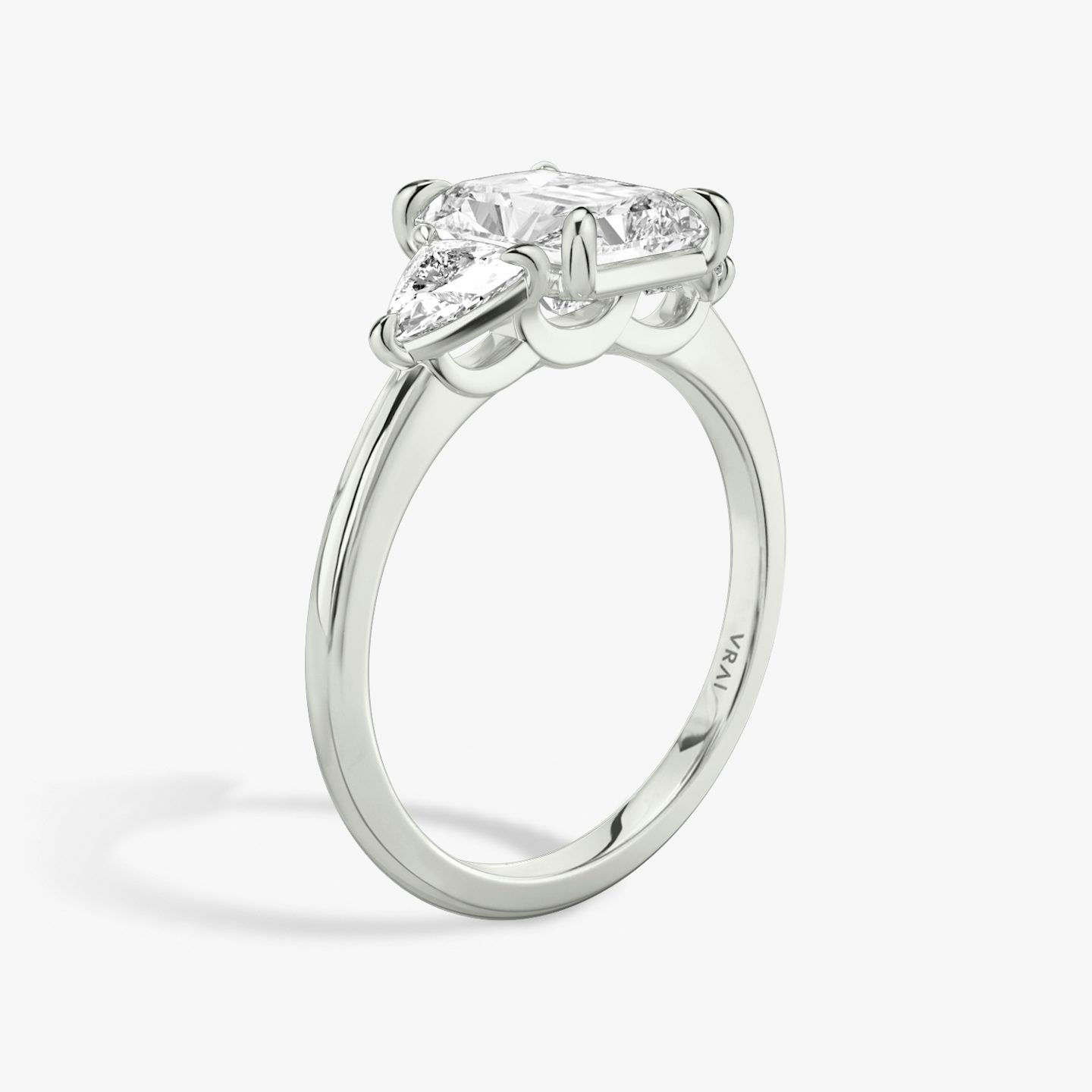The Three Stone | Radiant | Platinum | bandAccent: Plain | sideStoneCarat: 0.25ct | sideStoneShape: Trillion | diamondOrientation: vertical | caratWeight: other