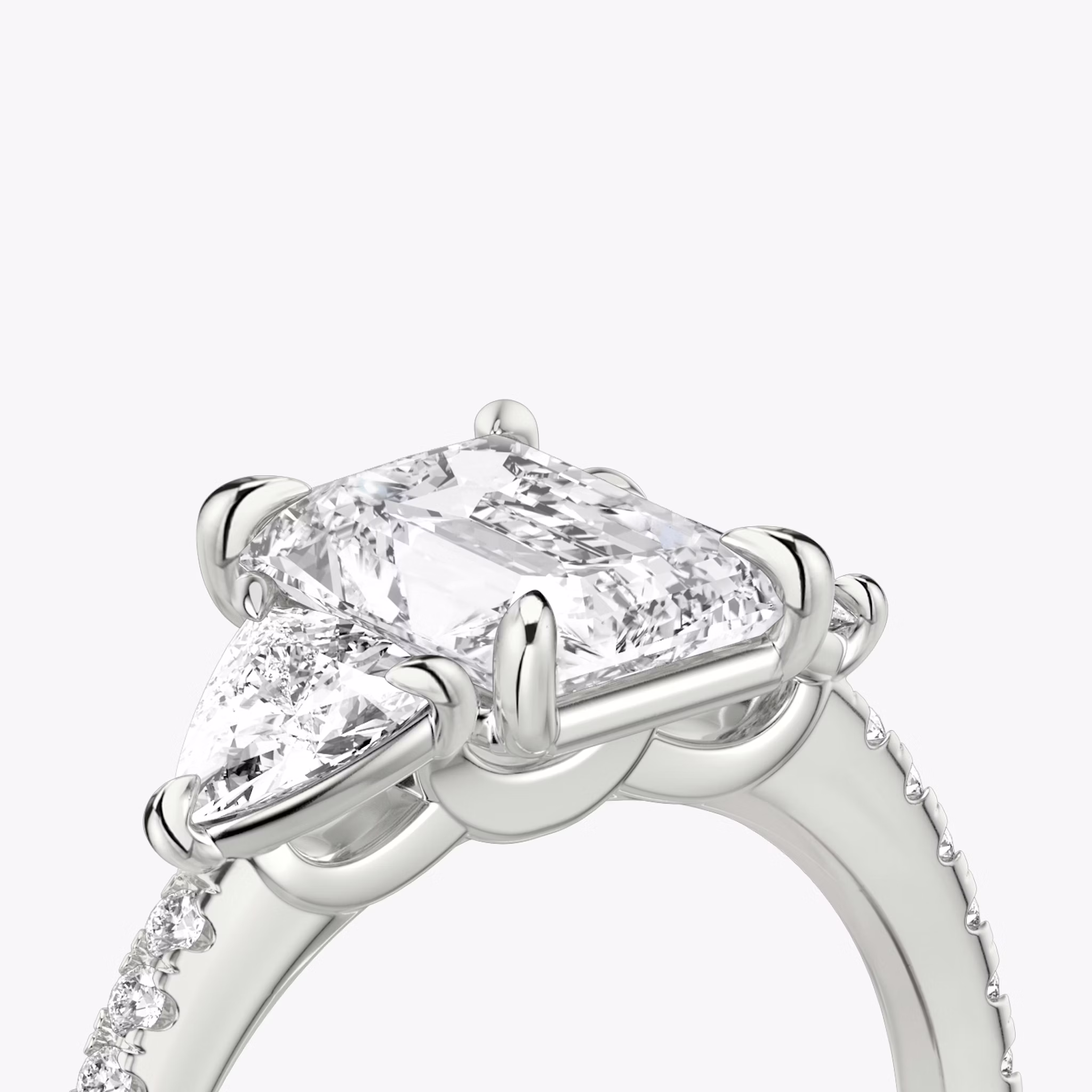 The Three Stone | Radiant | Platinum | bandAccent: Pavé | sideStoneCarat: 0.25ct | sideStoneShape: Trillion | diamondOrientation: vertical | caratWeight: other