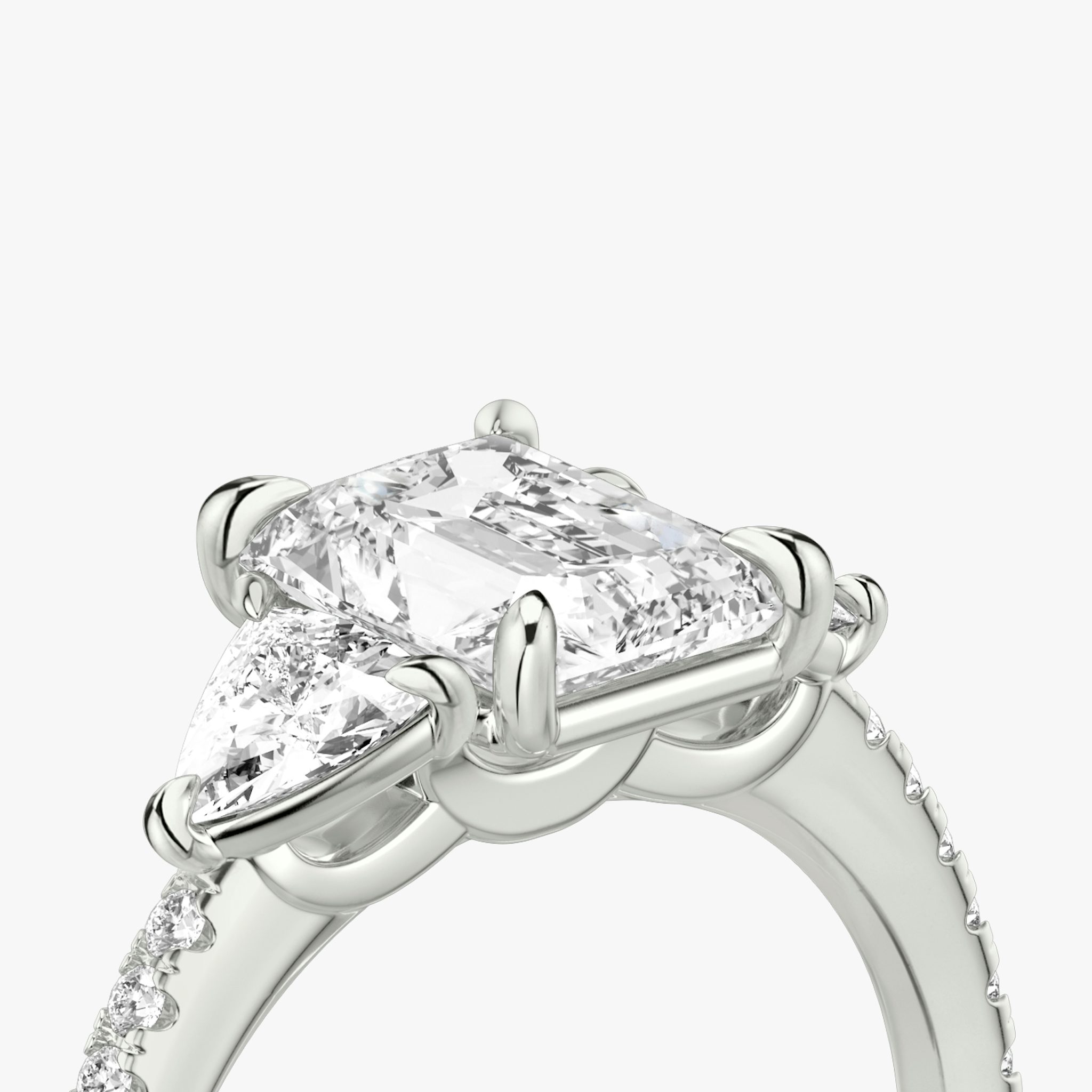 The Three Stone | Radiant | Platinum | bandAccent: Pavé | sideStoneCarat: 0.25ct | sideStoneShape: Trillion | diamondOrientation: vertical | caratWeight: other