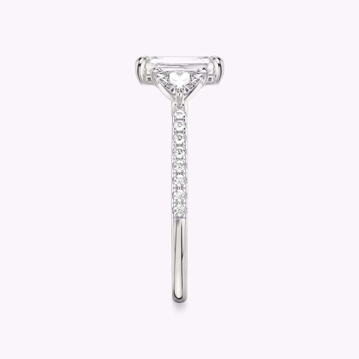 The Three Stone | Radiant | Platinum | bandAccent: Pavé | sideStoneCarat: 0.25ct | sideStoneShape: Trillion | diamondOrientation: vertical | caratWeight: other
