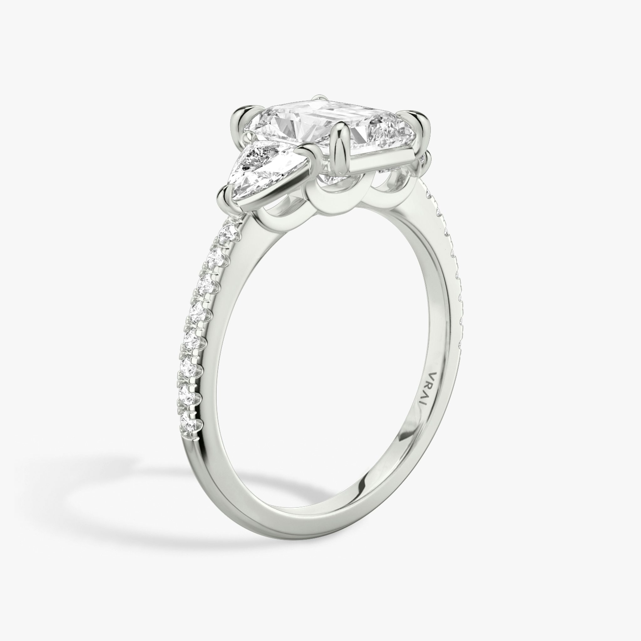 The Three Stone | Radiant | Platinum | bandAccent: Pavé | sideStoneCarat: 0.25ct | sideStoneShape: Trillion | diamondOrientation: vertical | caratWeight: other