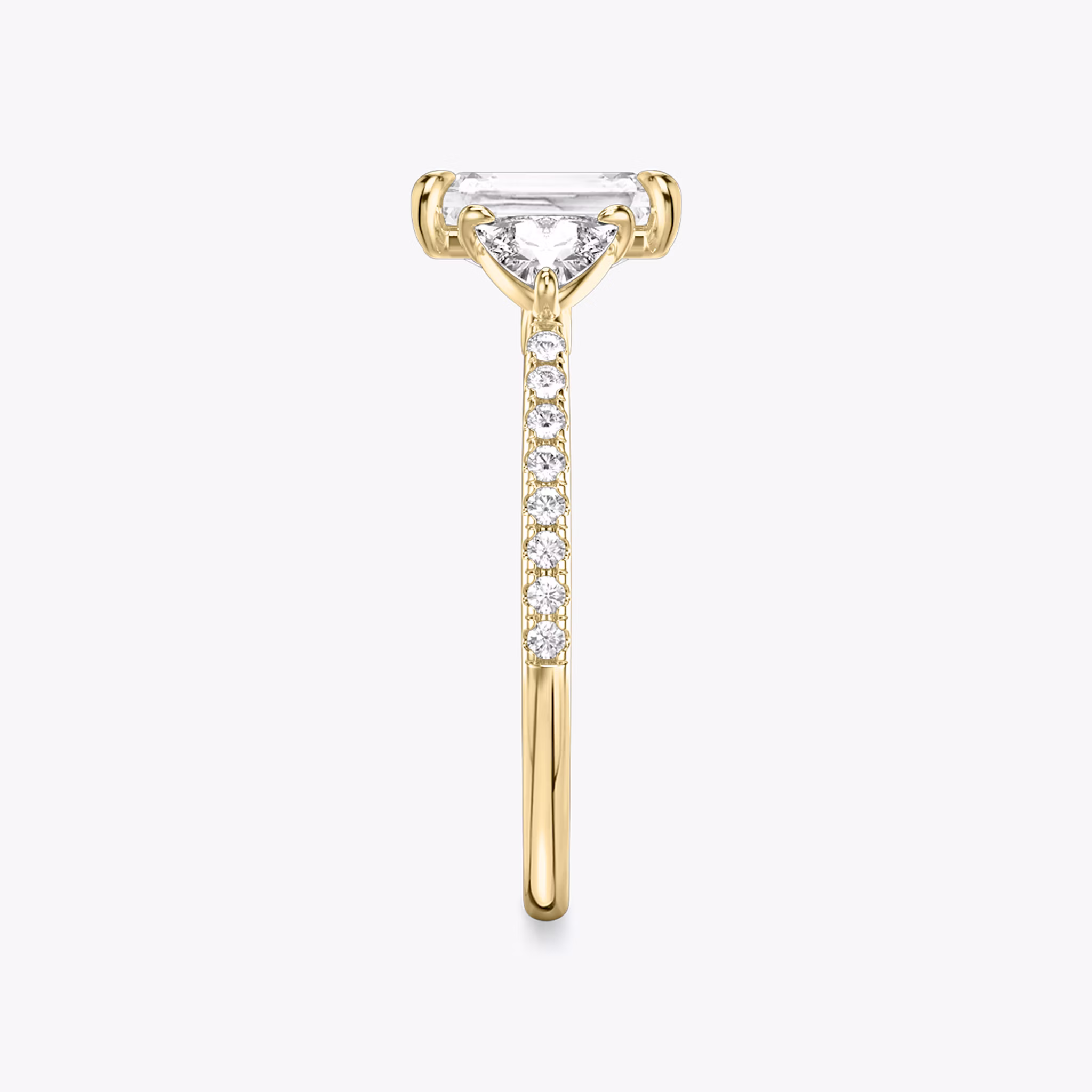 The Three Stone | Radiant | 18k | Yellow Gold | bandAccent: Pavé | sideStoneCarat: 0.25ct | sideStoneShape: Trillion | diamondOrientation: vertical | caratWeight: other