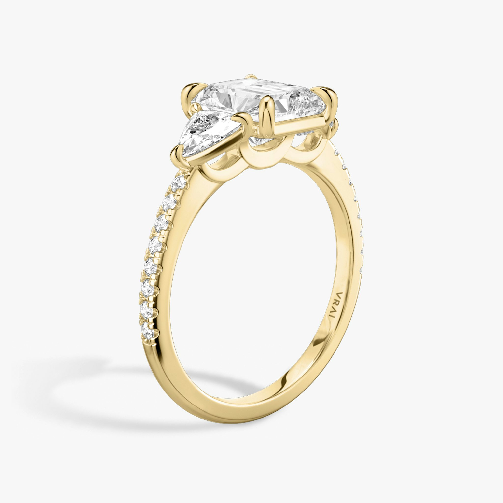The Three Stone | Radiant | 18k | Yellow Gold | bandAccent: Pavé | sideStoneCarat: 0.25ct | sideStoneShape: Trillion | diamondOrientation: vertical | caratWeight: other