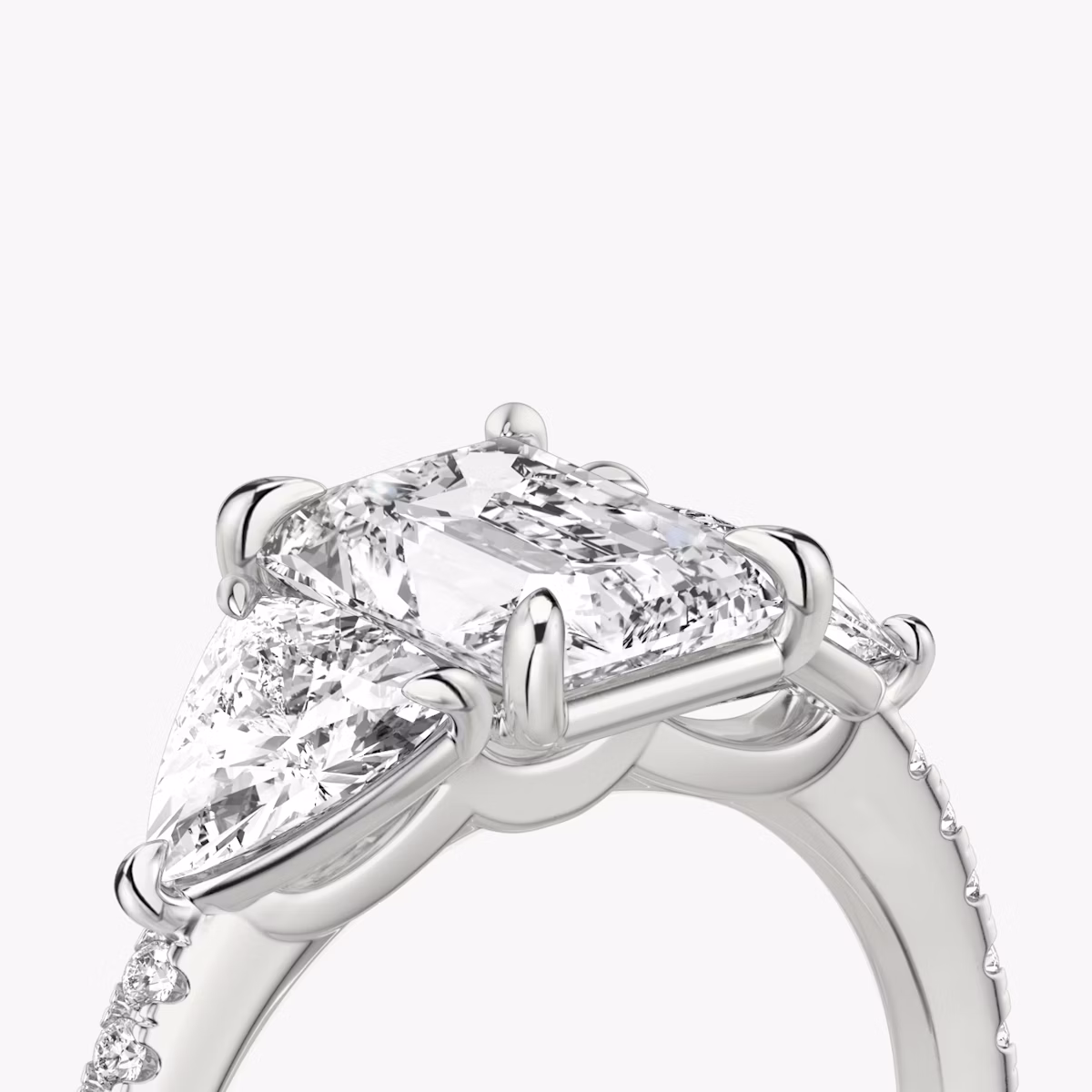 The Three Stone | Radiant | Platinum | bandAccent: Pavé | sideStoneCarat: 0.50ct | sideStoneShape: Trillion | diamondOrientation: vertical | caratWeight: other