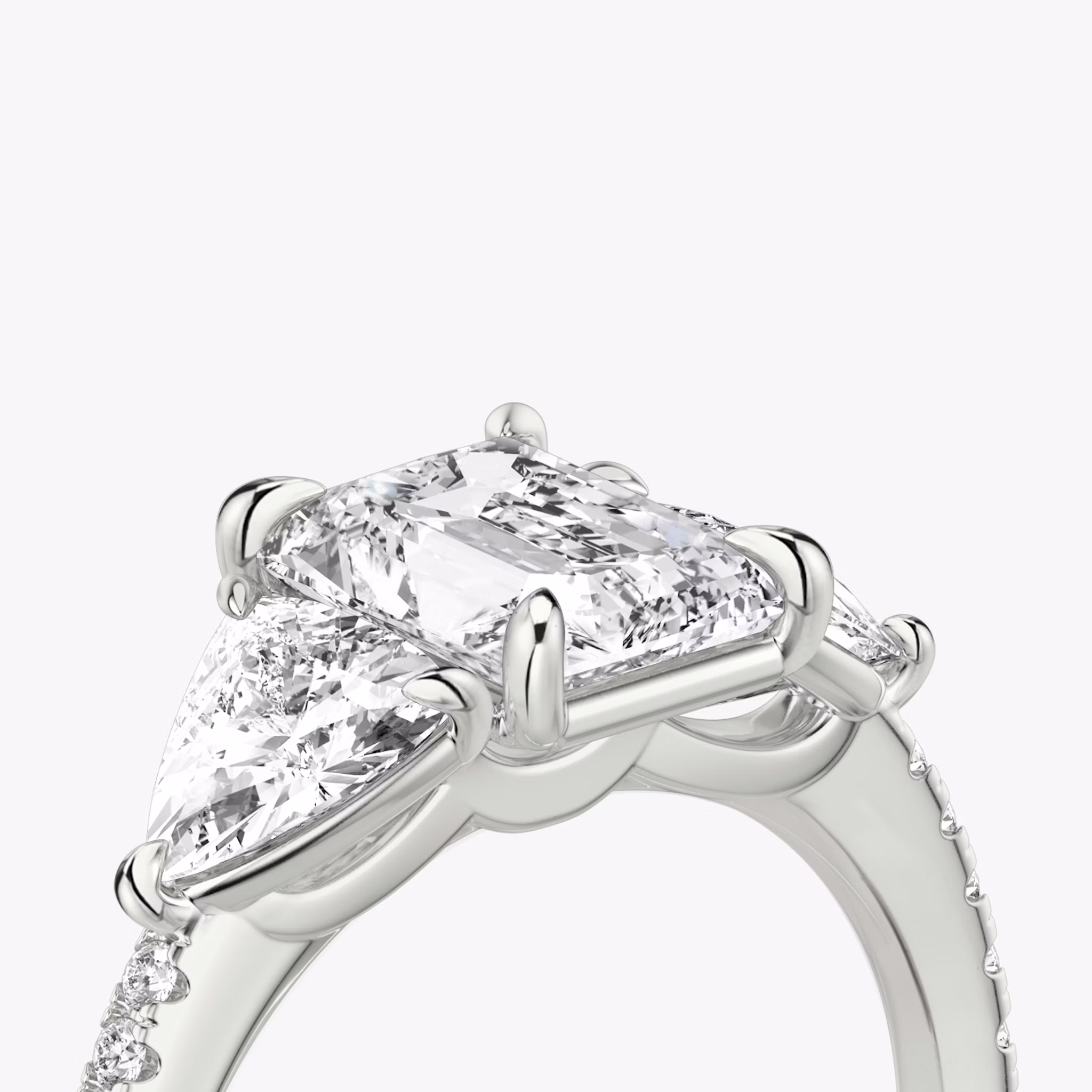 The Three Stone | Radiant | 18k | White Gold | bandAccent: Pavé | sideStoneCarat: 0.50ct | sideStoneShape: Trillion | diamondOrientation: vertical | caratWeight: other