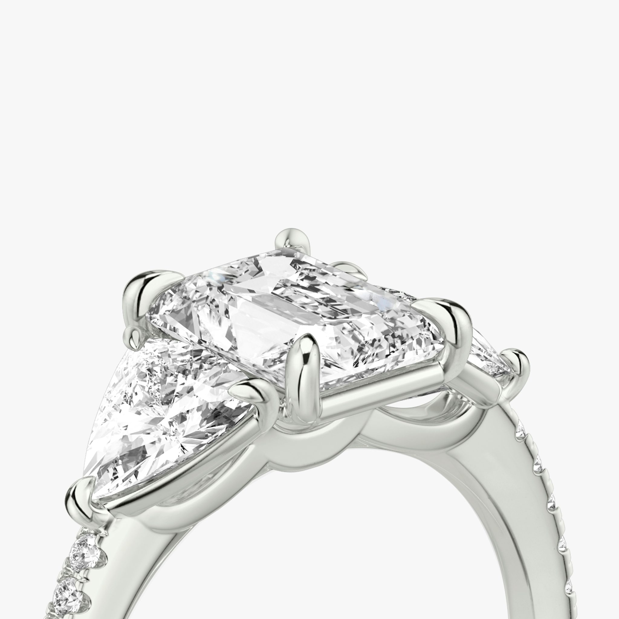 The Three Stone | Radiant | 18k | White Gold | bandAccent: Pavé | sideStoneCarat: 0.50ct | sideStoneShape: Trillion | diamondOrientation: vertical | caratWeight: other