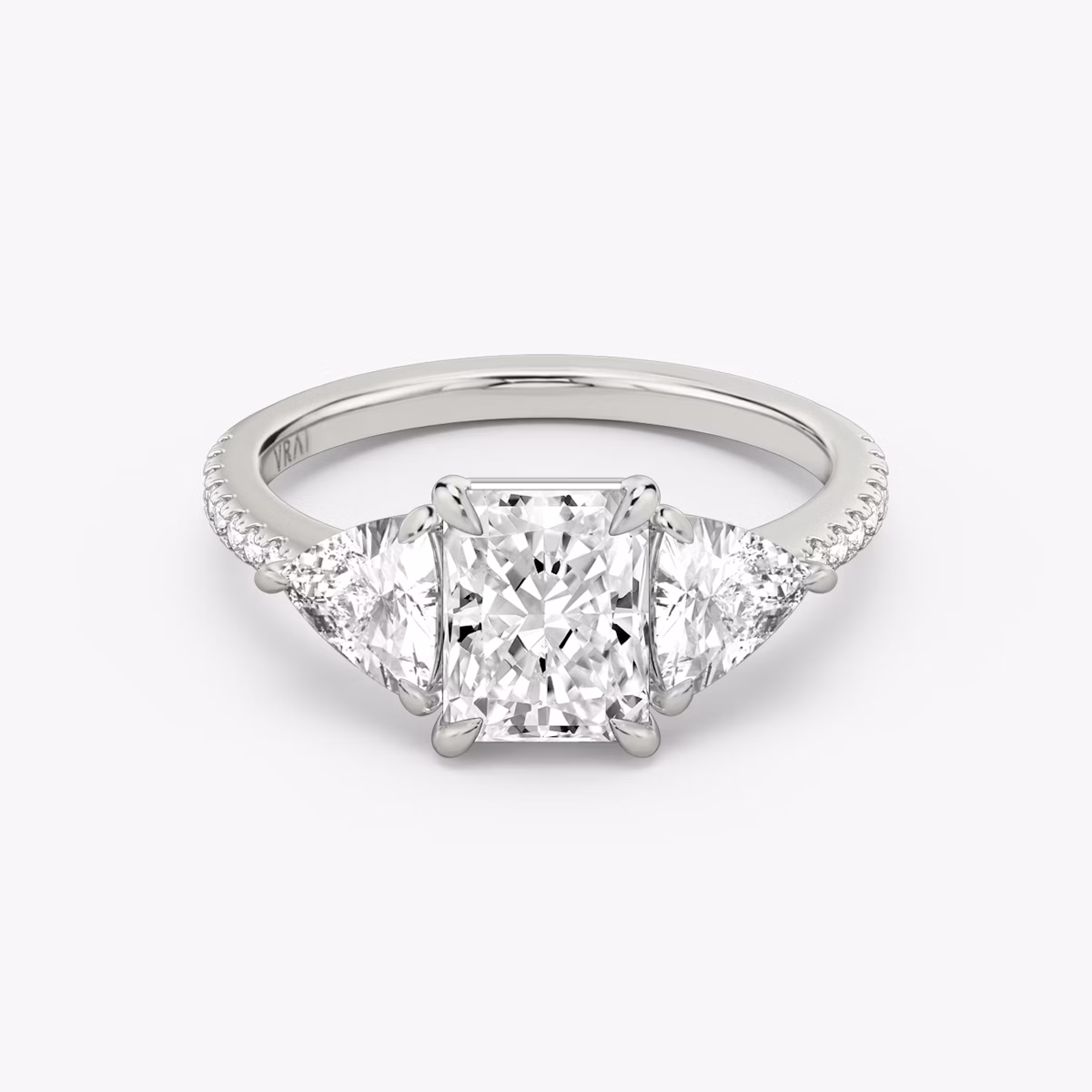 The Three Stone | Radiant | Platinum | bandAccent: Pavé | sideStoneCarat: 0.50ct | sideStoneShape: Trillion | diamondOrientation: vertical | caratWeight: other