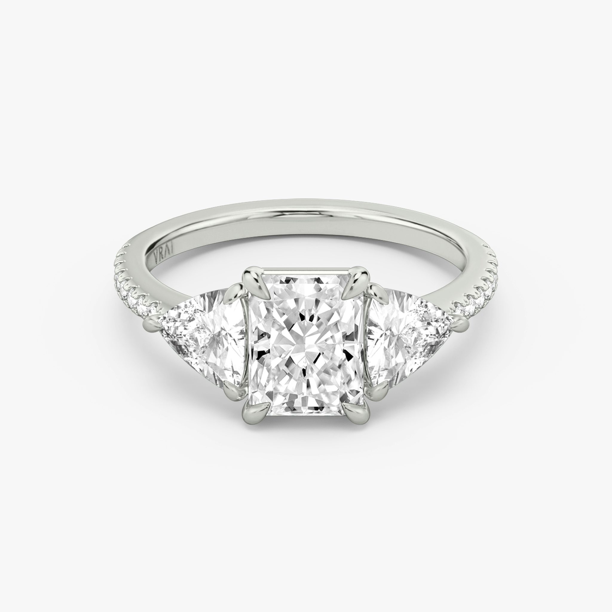 The Three Stone | Radiant | 18k | White Gold | bandAccent: Pavé | sideStoneCarat: 0.50ct | sideStoneShape: Trillion | diamondOrientation: vertical | caratWeight: other